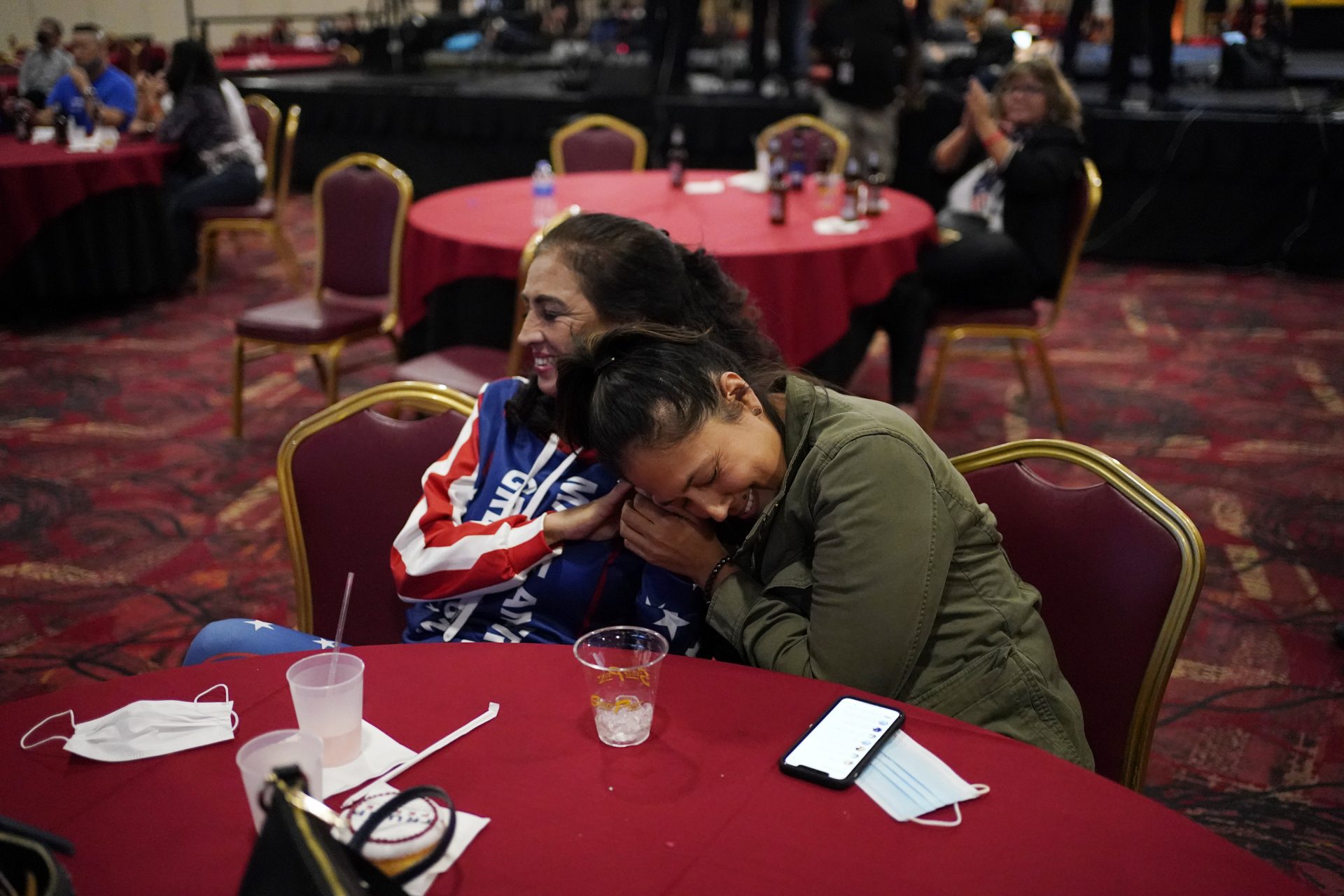Donald Trump supporters Dina Lynn, right, celebrates with Loretta Oakes while watching election returns in favor of Trump at a Republican election night watch party, Tuesday, Nov. 3, 2020, in Las Vegas. (AP Photo/John Locher)