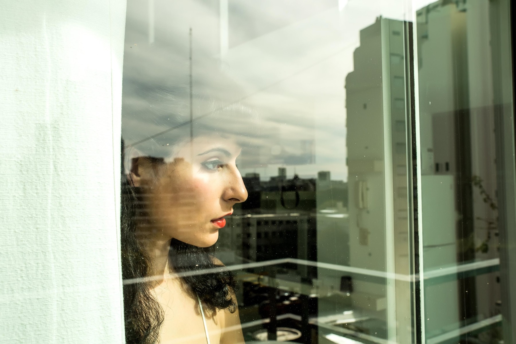 A pensive vintage girl standing behind a window.,Image: 311597982, License: Royalty-free, Restrictions: , Model Release: yes, Credit line: Spectral / Alamy / Alamy / Profimedia