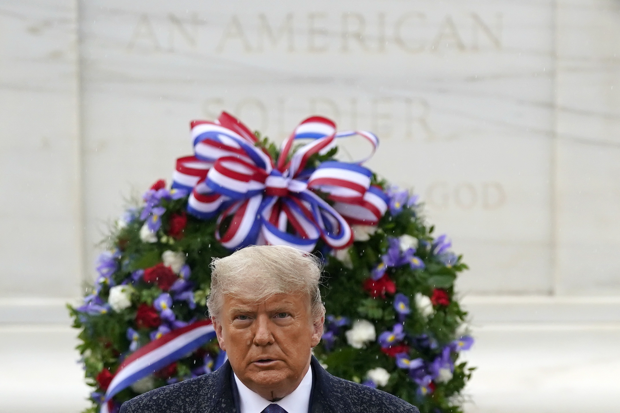 President Donald Trump participates in a Veterans Day wreath laying ceremony at the Tomb of the Unknown Soldier at Arlington National Cemetery in Arlington, Va., Wednesday, Nov. 11, 2020. (AP Photo/Patrick Semansky)