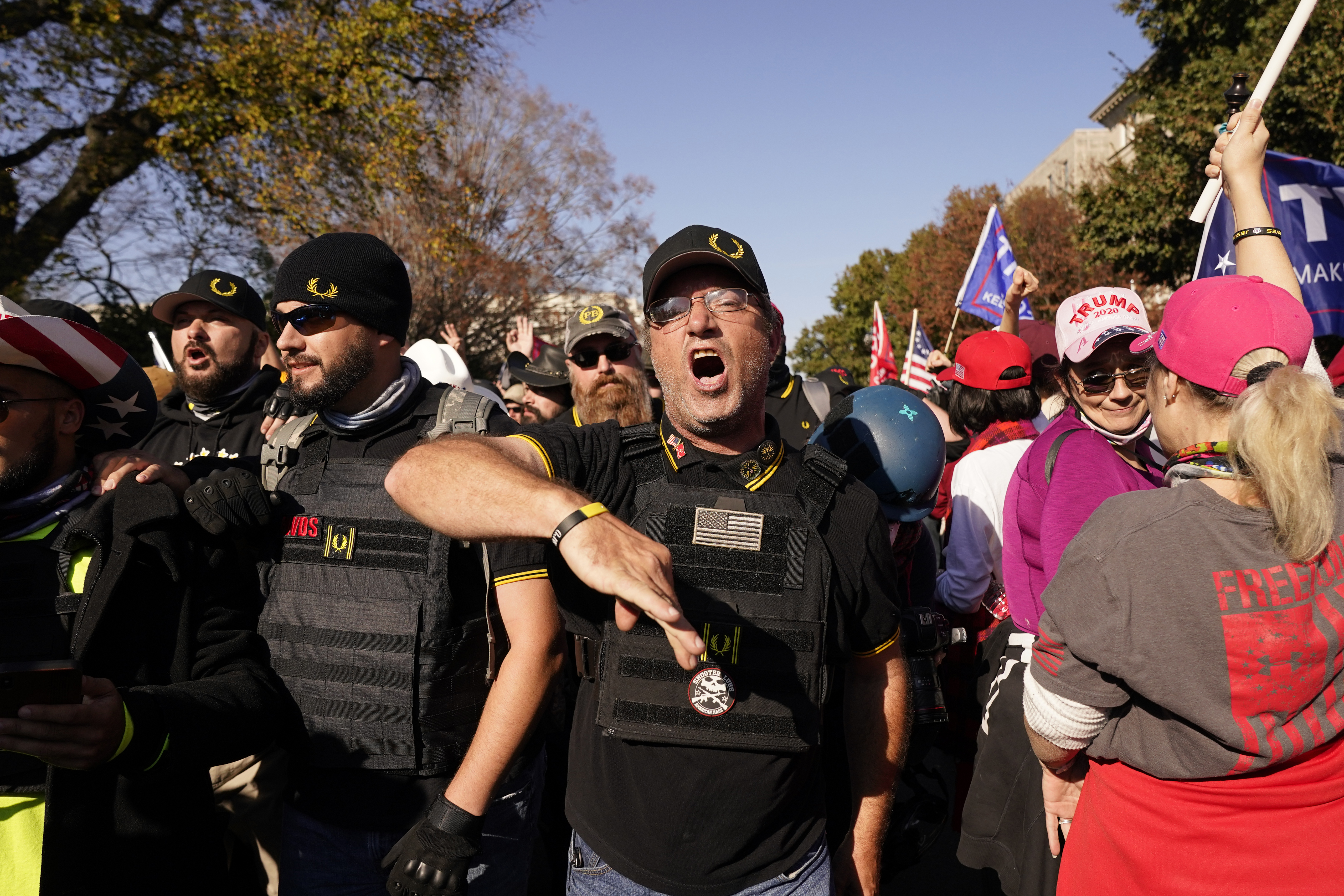 People identifying themselves as members of the Proud Boys join supporters of President Donald Trump as they march Saturday Nov. 14, 2020, in Washington. (AP Photo/Jacquelyn Martin)