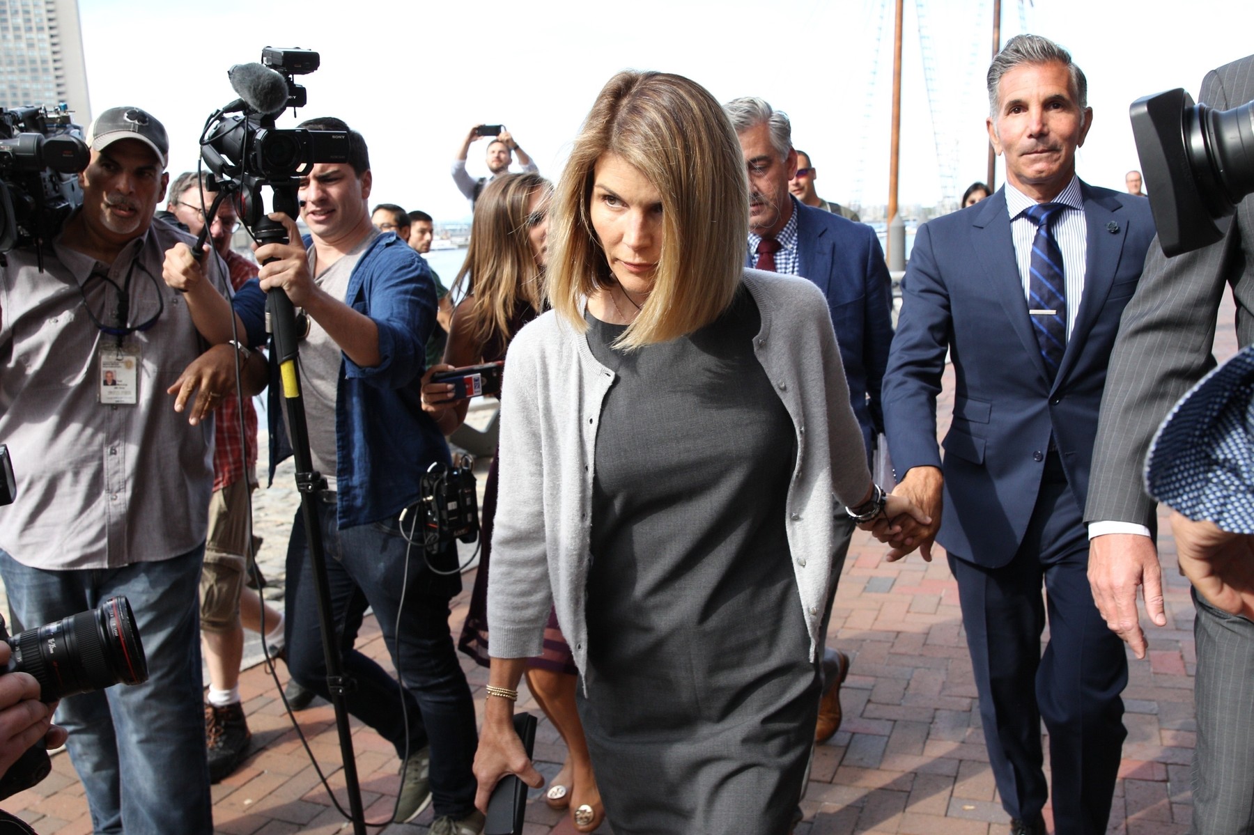 Lori Loughlin and husband Mossimo Giannulli exiting courthouse