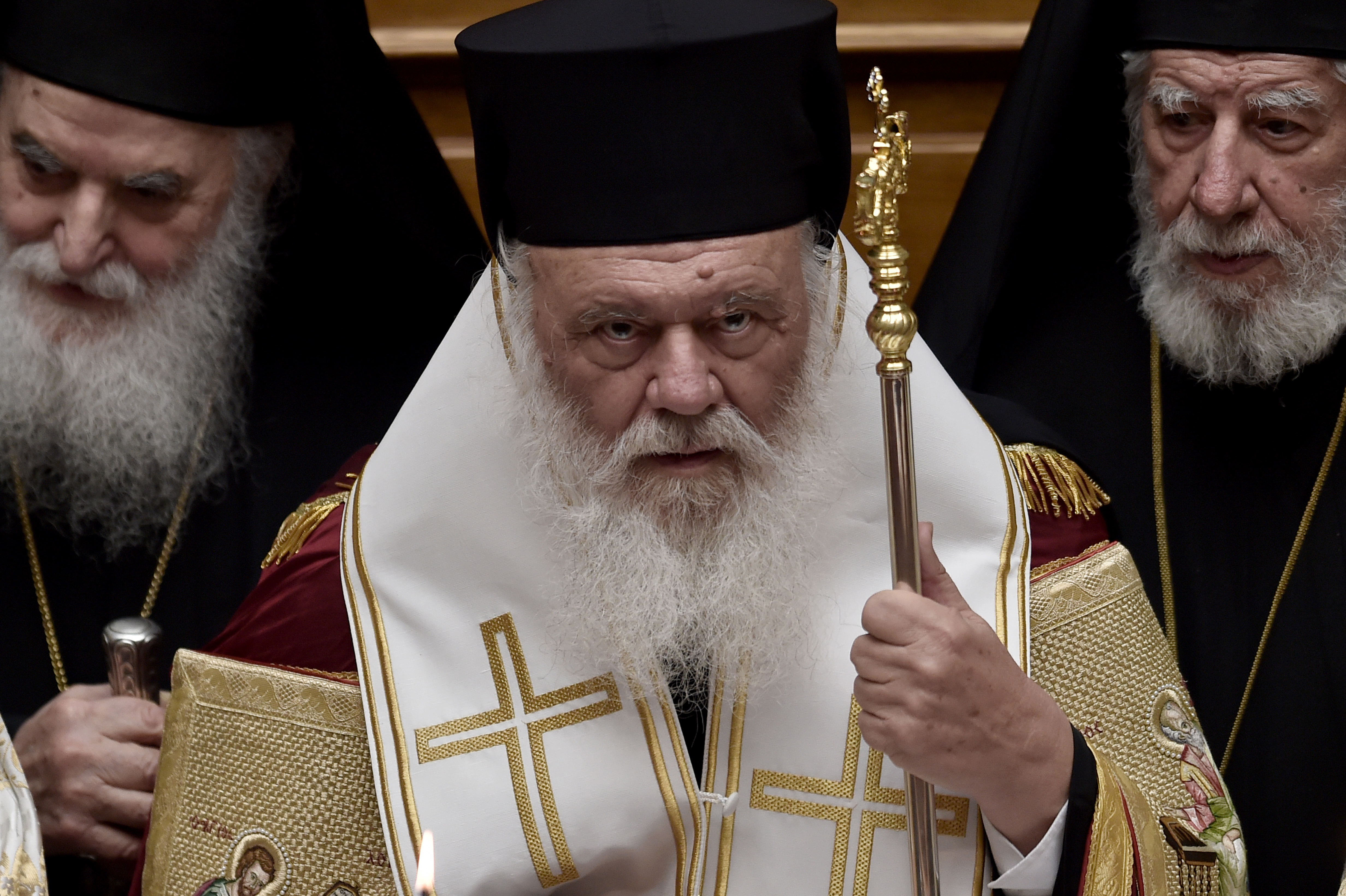 epa04661027 Greek Archbishop Ieronymos II looks on during the swearing-in ceremony of new Greek President Prokopis Pavlopoulos in the parliament in Athens, Greece, 13 March 2015.  EPA/ARIS MESSINIS / POOL