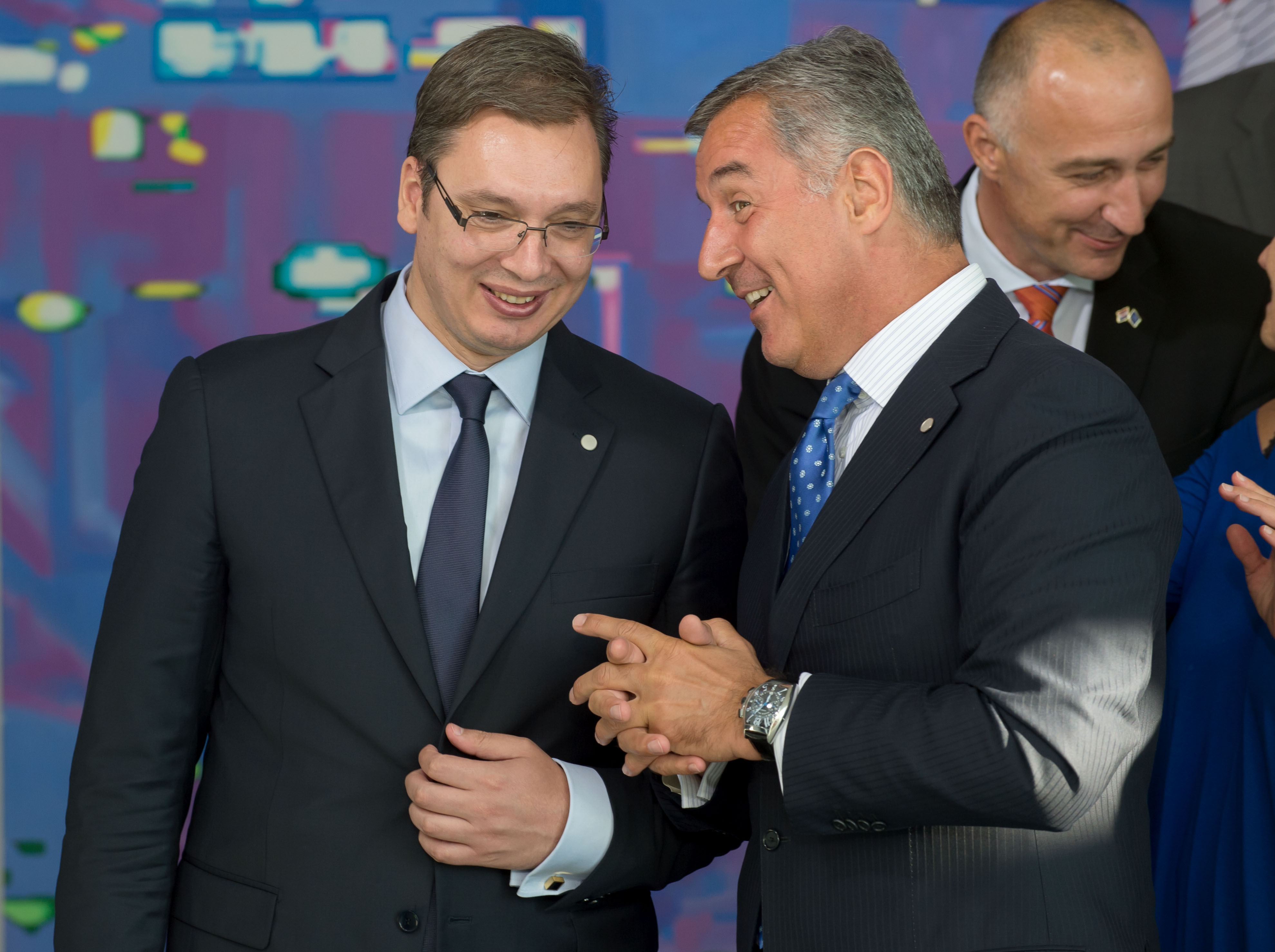 epa04372799 Serbian Prime Minister, Aleksander Vucic (L), and his counterpart from Montenegro, Milo Djukanovic, during the group photo at  the West Balkans Conference in the German Chancellery in Berlin, Germany, 28 August 2014.  EPA/TIM BRAKEMEIER