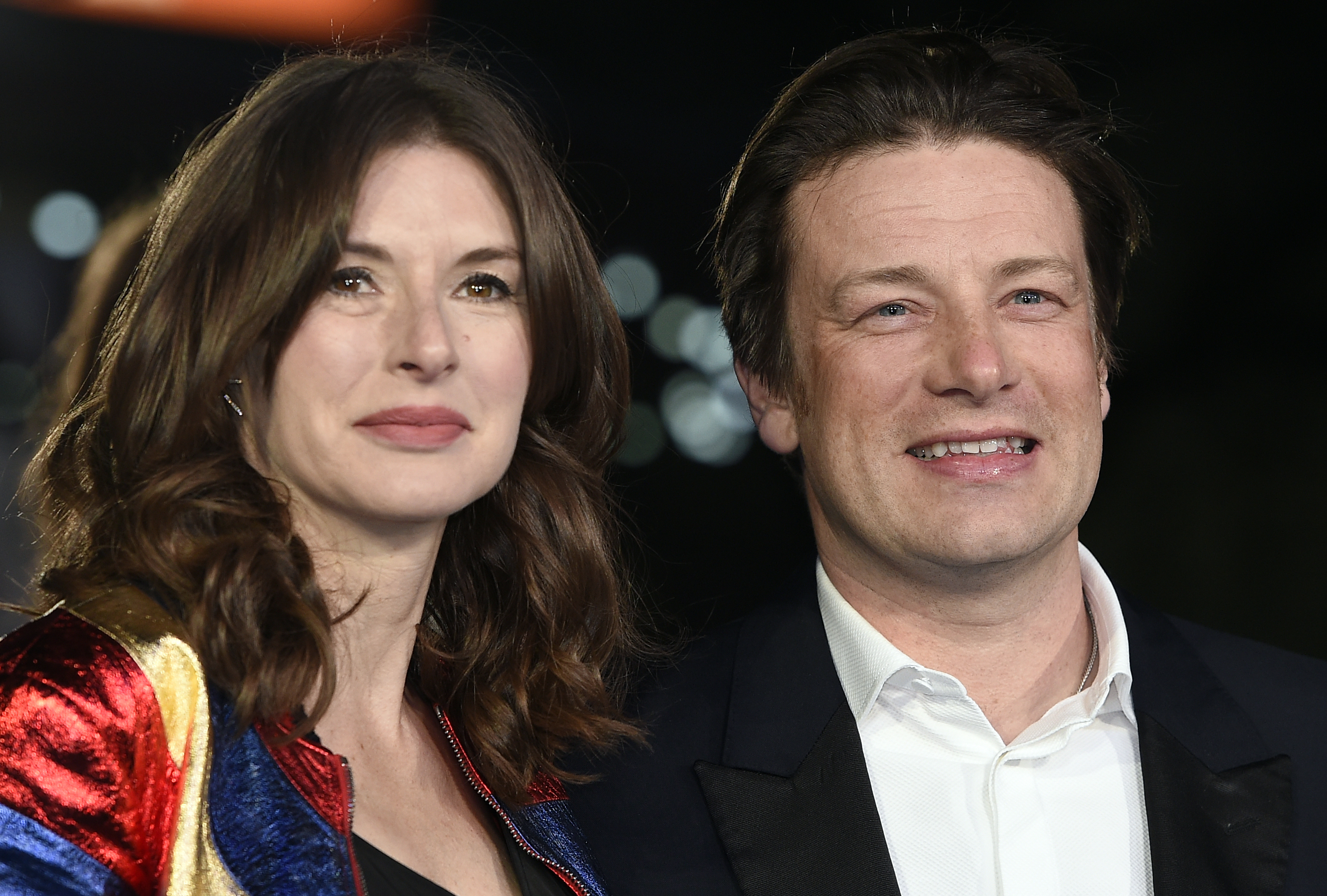 epa05216920 British chef Jamie Oliver (R) and his wife Jools Oliver (L) arrive for the European premiere of 'Eddie the Eagle' at Leicester Square in London, Britain, 17 March 2016. The movie opens in British theaters on 28 March.  EPA/FACUNDO ARRIZABALAGA