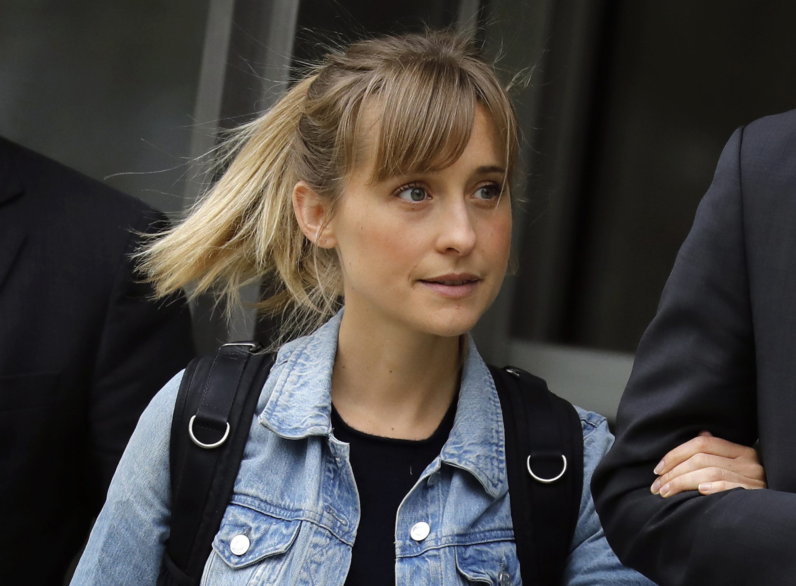 epa06690193 Actress Allison Mack exits federal court in Brooklyn, New York, USA, 24 April 2018. Mack was arrested last week on charges of recruiting women into a sex trafficking operation.  EPA-EFE/PETER FOLEY