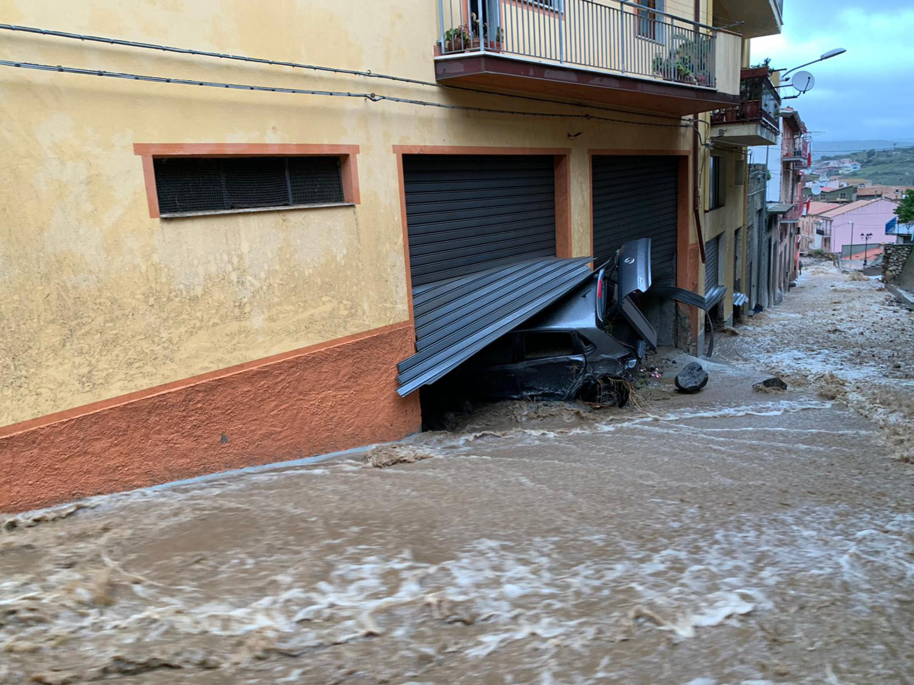 epa08850591 The damage caused by the flood that hit Bitti in the Sardinia island, Italy, 29 November 2020. According to reports, three people have been killed in a flooding and mudslides after heavy rains in Bitti.  EPA-EFE/CRISTIAN FARINA