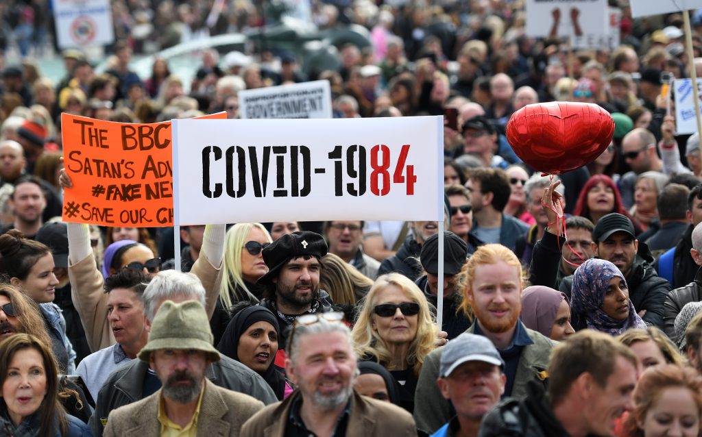 epa08698826 People attend a 'We Do Not Consent' rally at Trafalgar Square in London, Britain, 26 September 2020. Thousends of people gathered at a demonstration to protest against new coronavirus restrictions.  EPA-EFE/ANDY RAIN