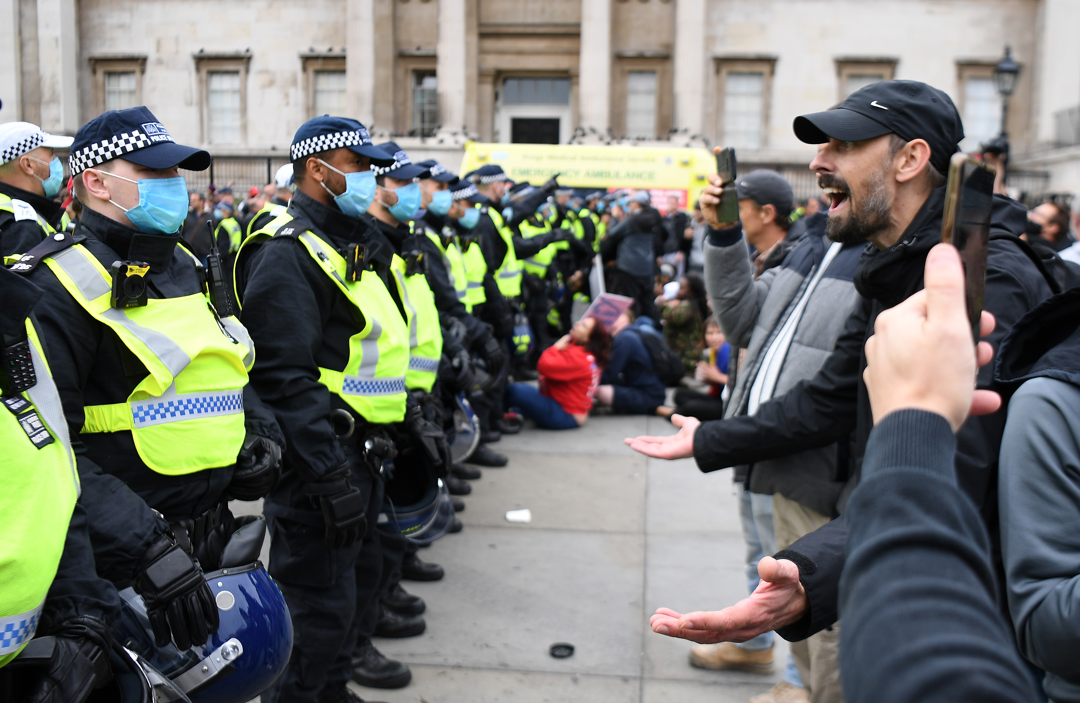 epa08699249 Police clash with protesters during a 'We Do Not Consent' rally at Trafalgar Square in London, Britain, 26 September 2020. Thousends of people gathered at a demonstration to protest against new coronavirus restrictions.  EPA-EFE/ANDY RAIN