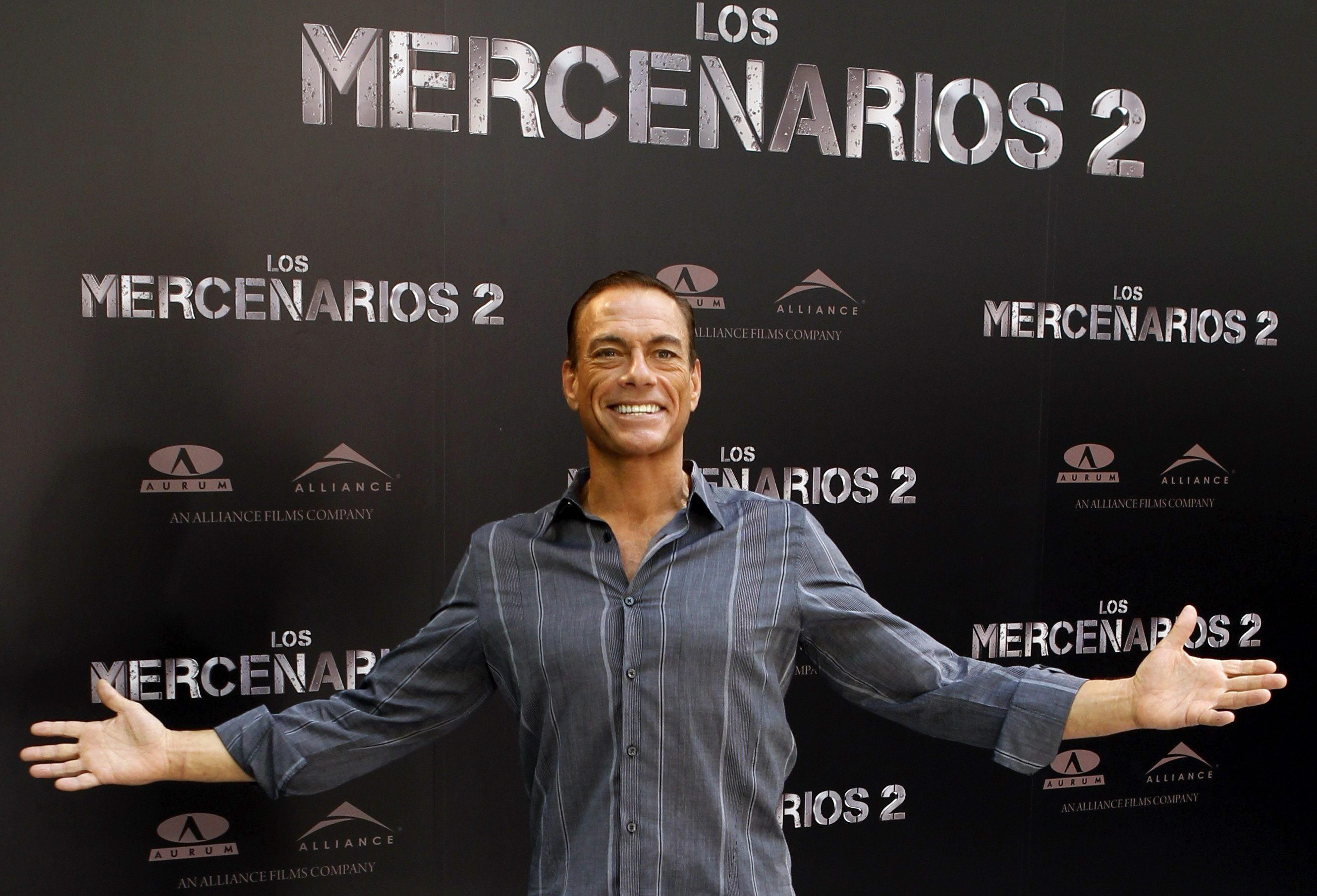 epa03349685 Belgian actor Jean-Claude Van Damme poses during the presentation of his film 'The Expendables 2' in Madrid, Spain, 08 August 2012. The action movie will be released in Spanish cinemas on 24 August.  EPA/J.J.GUILLEN