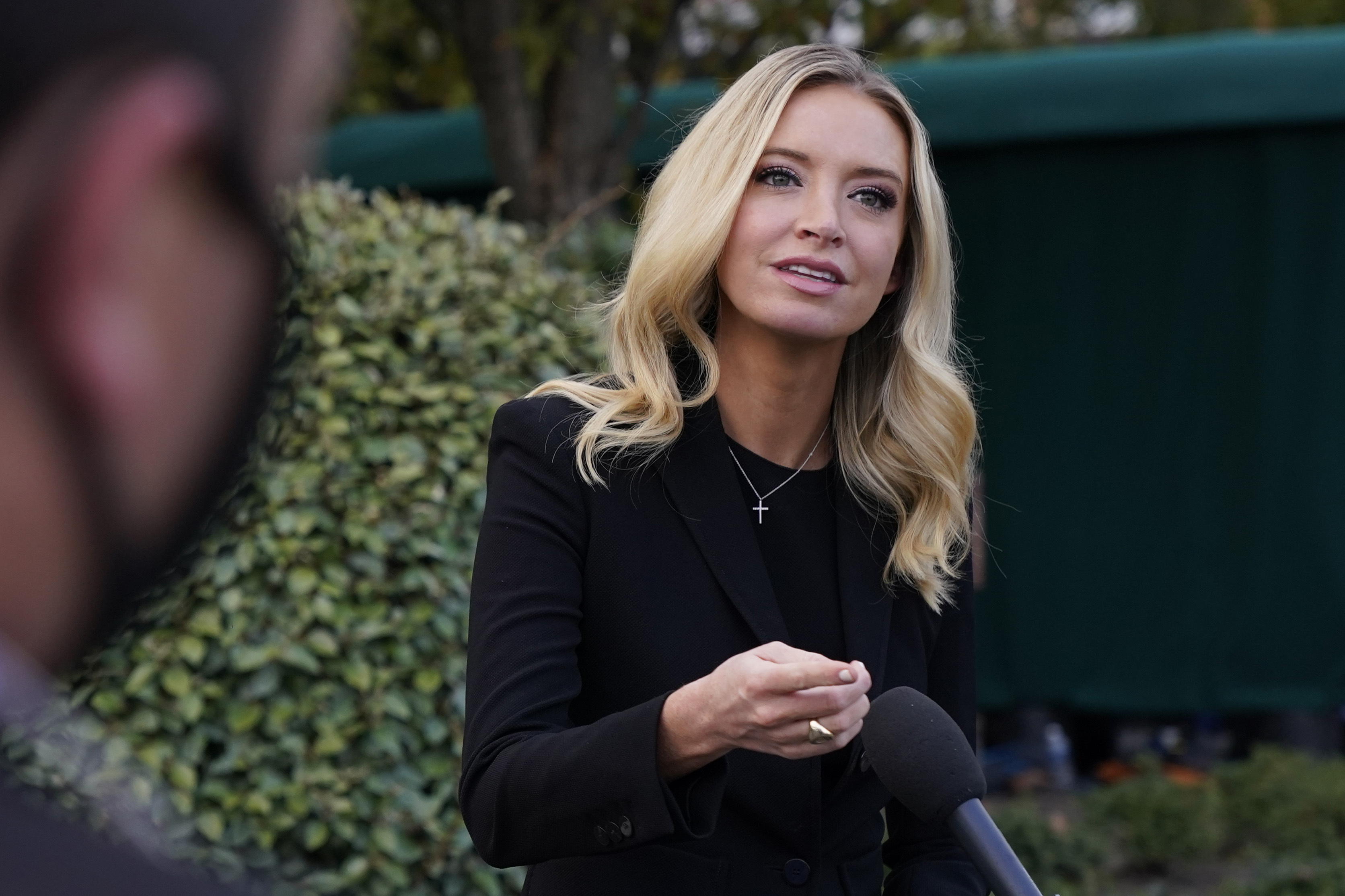 White House press secretary Kayleigh McEnany, talks to the media, Sunday, Oct. 4, 2020, outside the White House in Washington. (AP Photo/Jacquelyn Martin)
