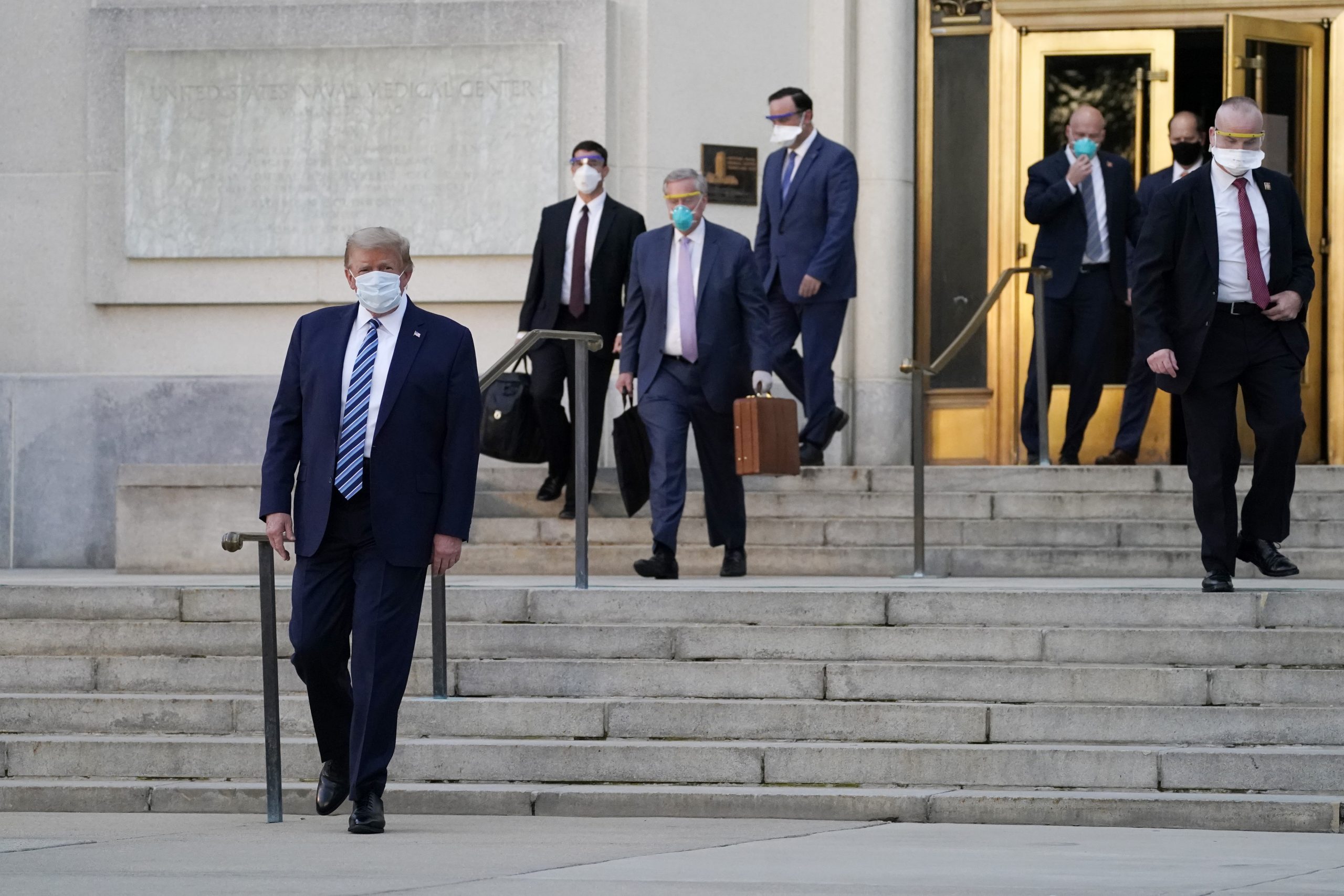 President Donald Trump walks out of Walter Reed National Military Medical Center to return to the White House after receiving treatments for covid-19, Monday, Oct. 5, 2020, in Bethesda, Md. (AP Photo/Evan Vucci)