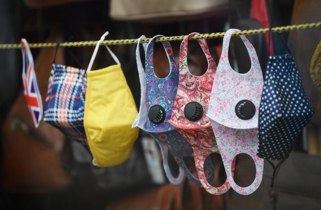 epa08740419 Masks are displayed in a shop in the Tower Hamlet area of London, Britain, 13 October 2020. The UK unemployment rate rose to 4.5 percent between June and August as the pandemic continued to hit jobs.  EPA-EFE/NEIL HALL