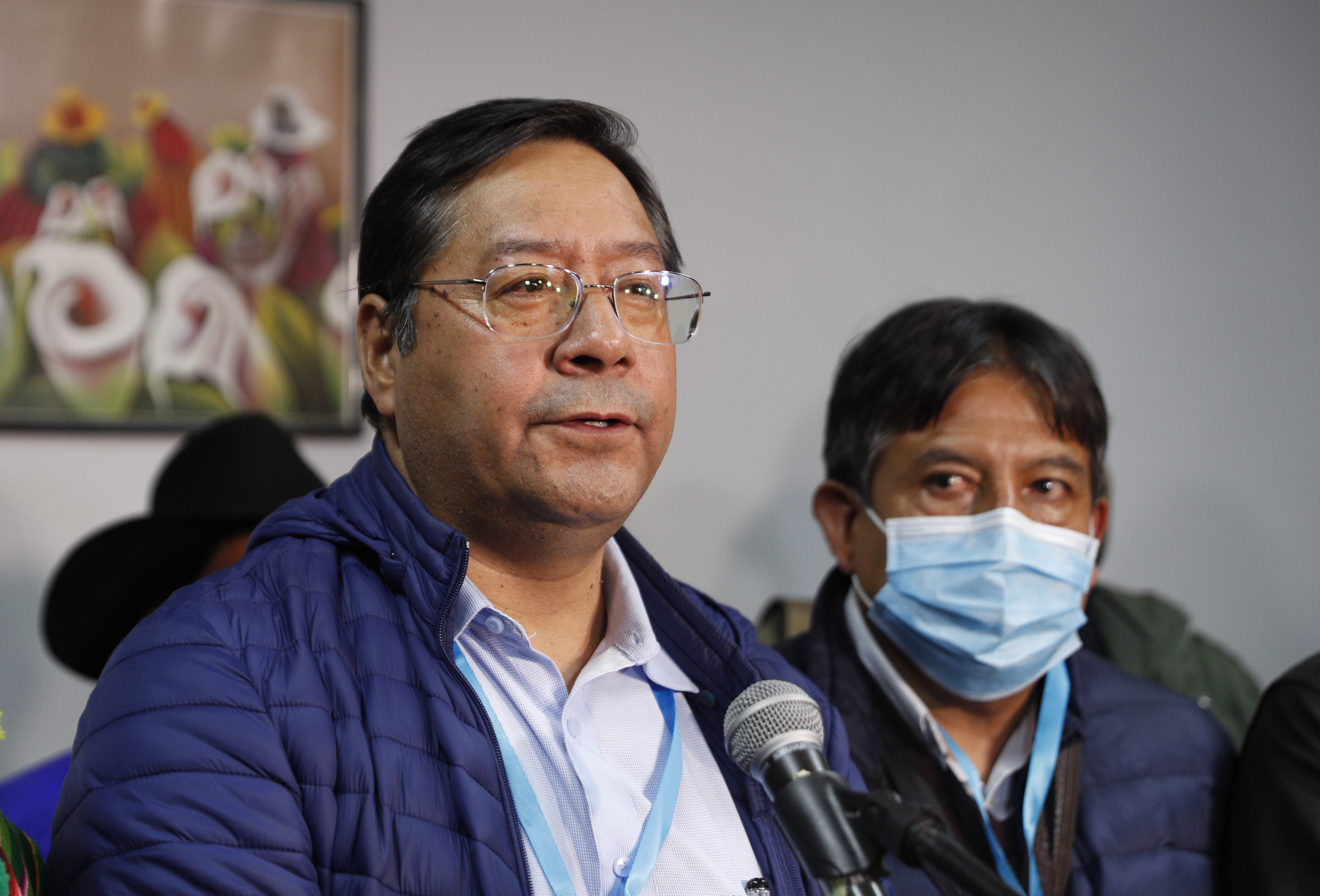 Luis Arce, presidential candidate for the Movement Towards Socialism (MAS) party, left, talks during a press conference after general elections in La Paz, Bolivia, Monday, Oct. 19, 2020. (AP Photo/Juan Karita)