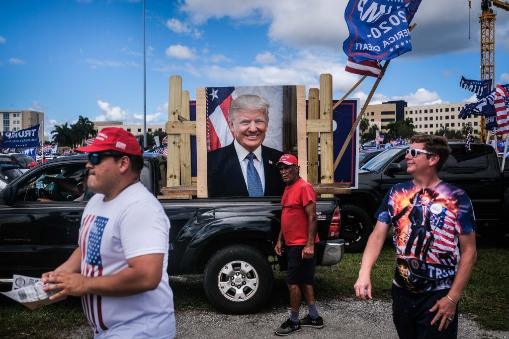epa08756458 Demonstrators participate in 'Latinos for Trump' demonstration, a parade in support of US President Donald J. Trump, at Tamiami Park in Miami, USA, 18 October 2020.  EPA-EFE/MARIO CRUZ