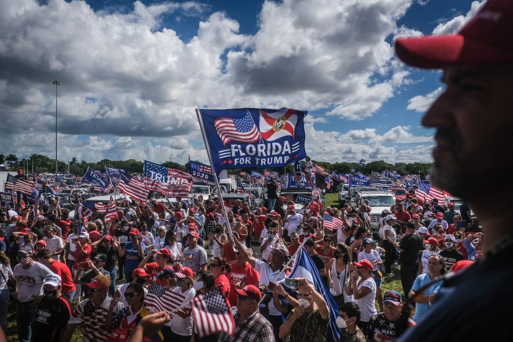 epa08756472 Demonstrators participate in 'Latinos for Trump' demonstration, a parade in support of US President Donald J. Trump, at Tamiami Park in Miami, USA, 18 October 2020.  EPA-EFE/MARIO CRUZ