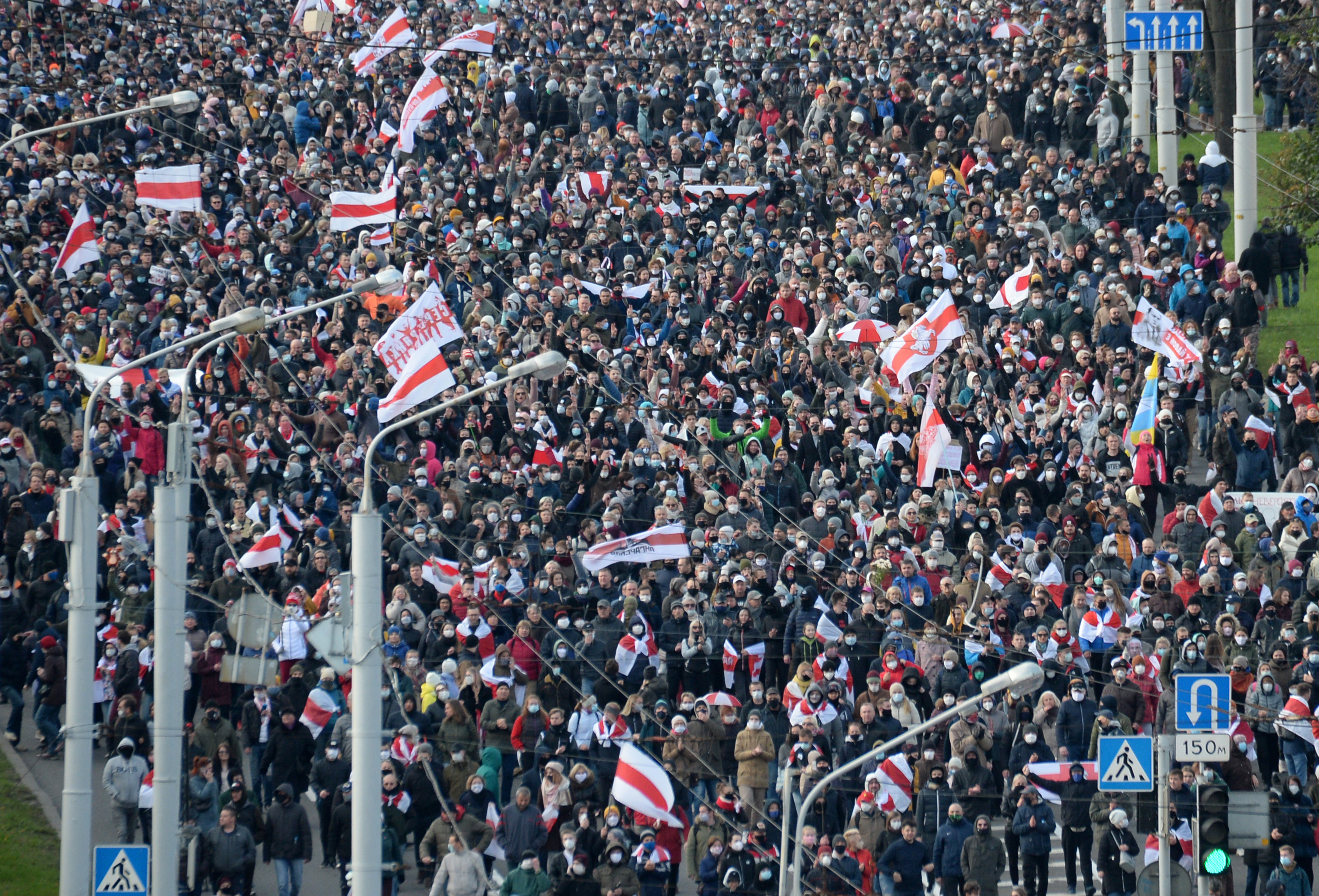 epa08755171 Protesters march during a rally to protest against the presidential election results in Minsk, Belarus, 18 October 2020. Opposition activists continue their protest actions, demanding new elections under international observation.  EPA-EFE/STR