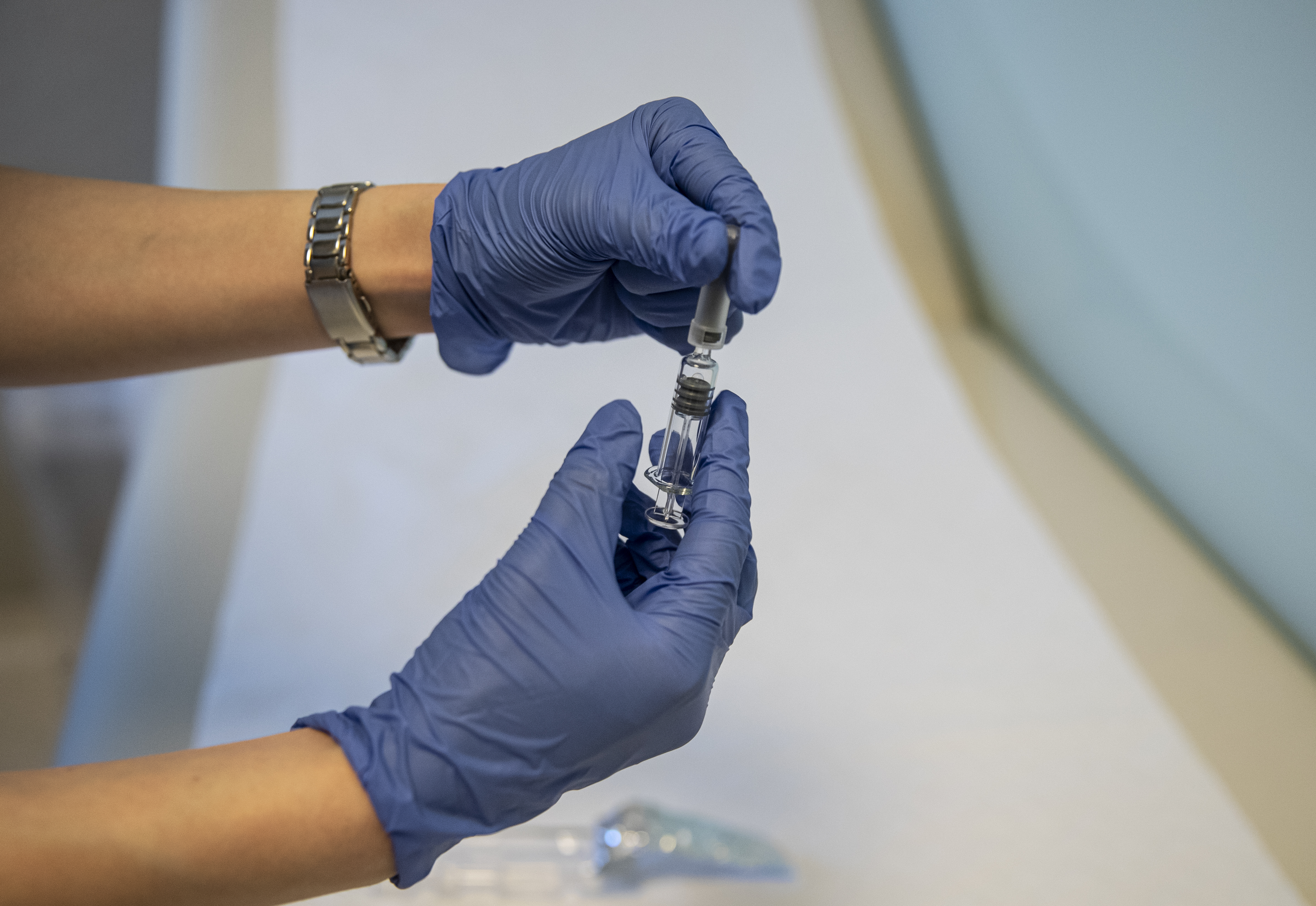 epa08731198 A health worker shows Sinovac Biotech's COVID-19 vaccine  during the 3rd phase trials at the Acibadem Hospital in Istanbul, Turkey, 09 October 2020.  EPA-EFE/ERDEM SAHIN