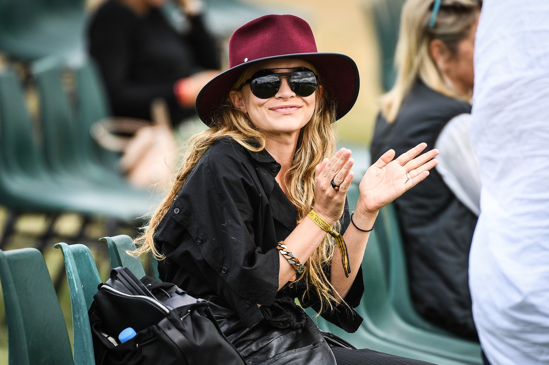 Mary Kate Olsen seen on a break, and smoking a cigarette after riding Fatum during the Longines Global Champions Tour at Chantilly. Twin sister Ashley Olsen was seen later in the afternoon wearing a dark red hat and matching sunglasses