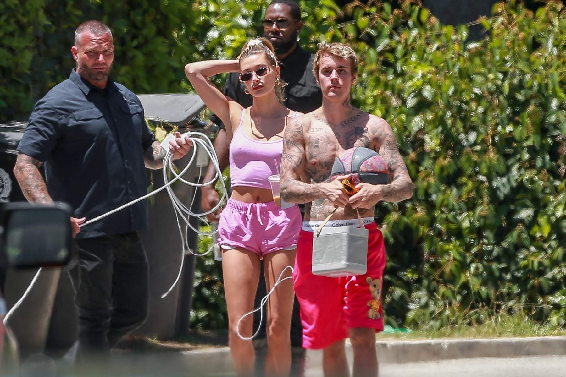 Hailey Bieber brings coffee to Justin while he plays ball