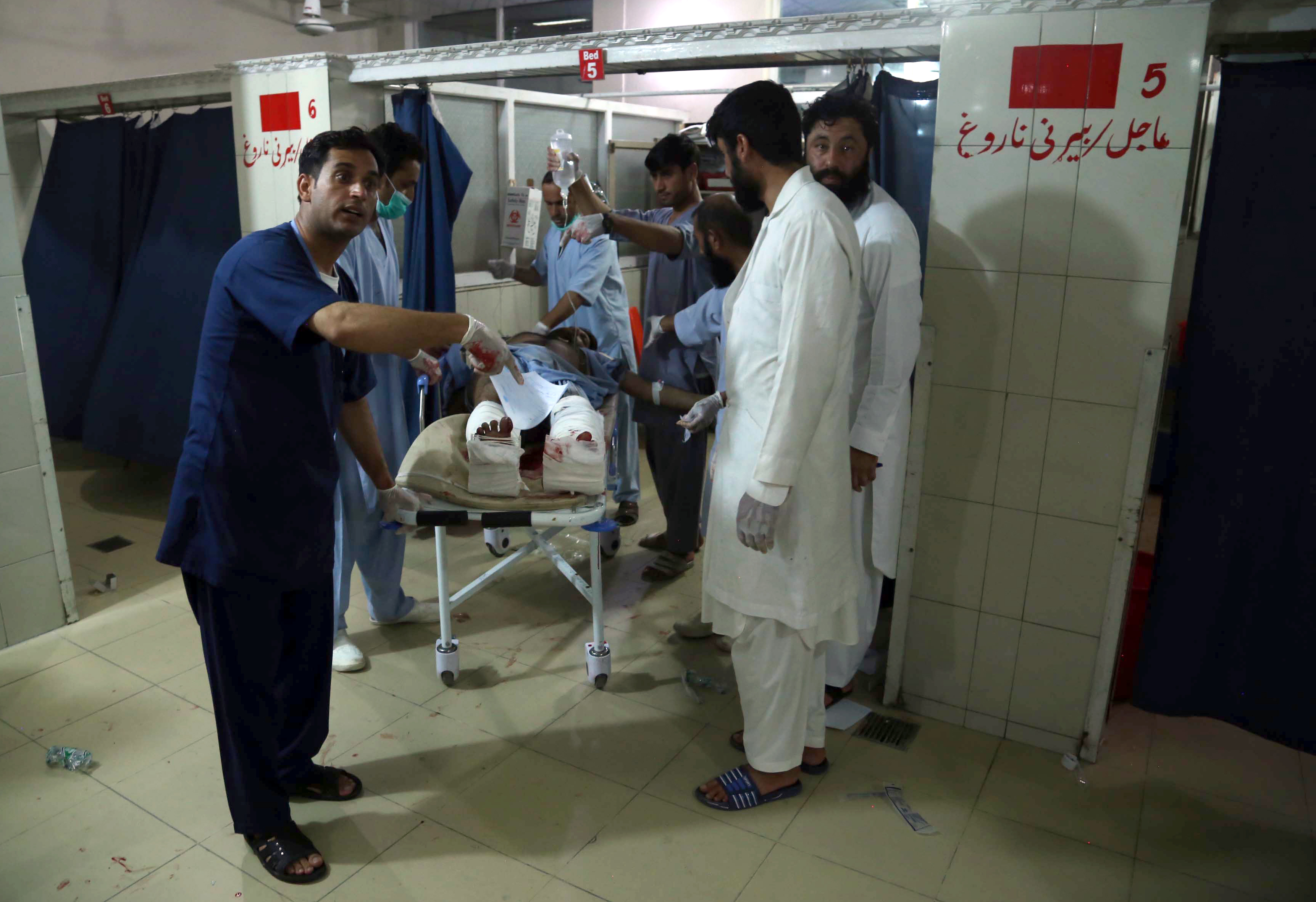 People injured by the bomb blast receive medical treatment
