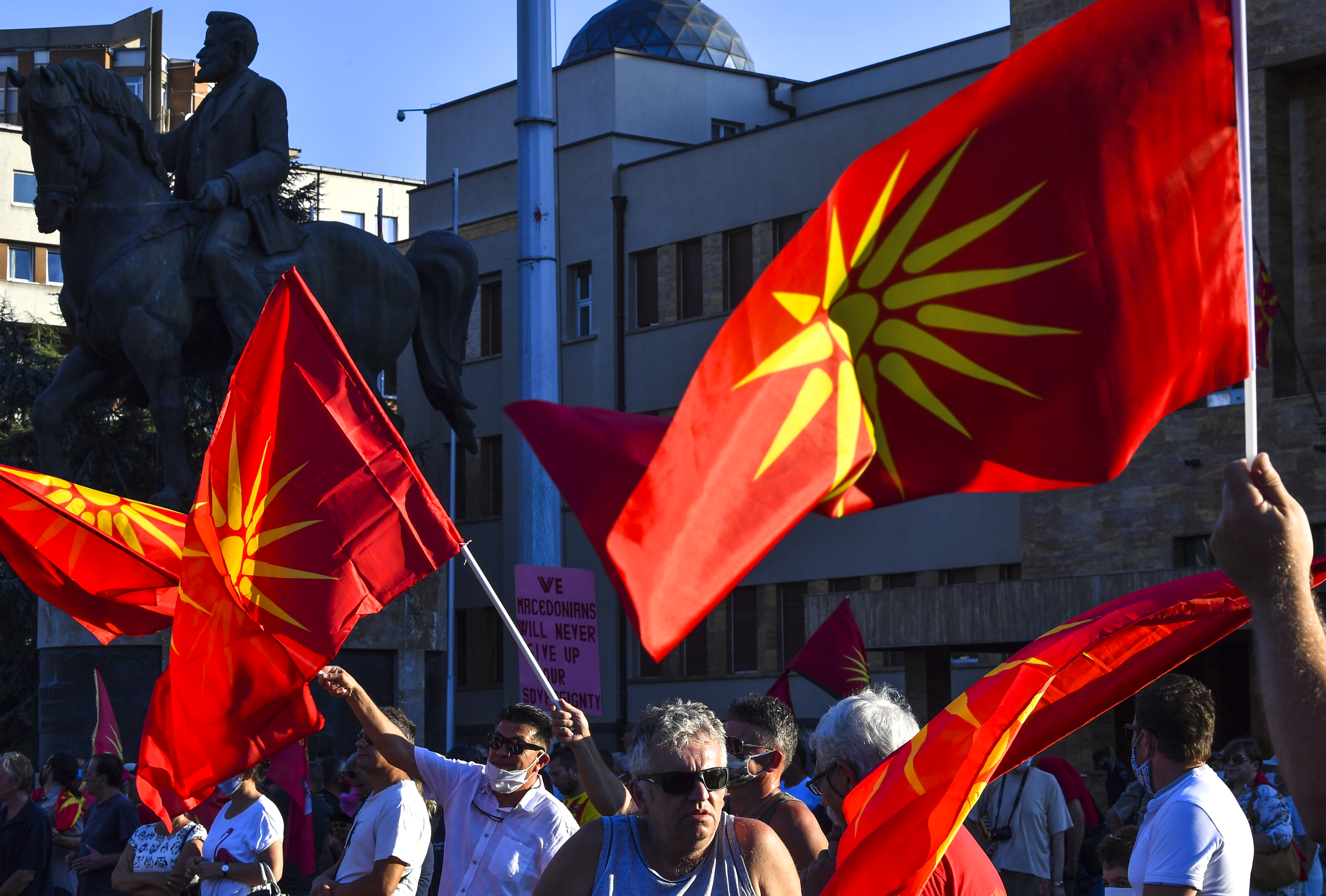 Right-wing Macedonians wave old Macedonian flag and carry banners with patriotic slogans during the  parliamentary session for voting of confidence for a new left-wing coalition government in Skopje