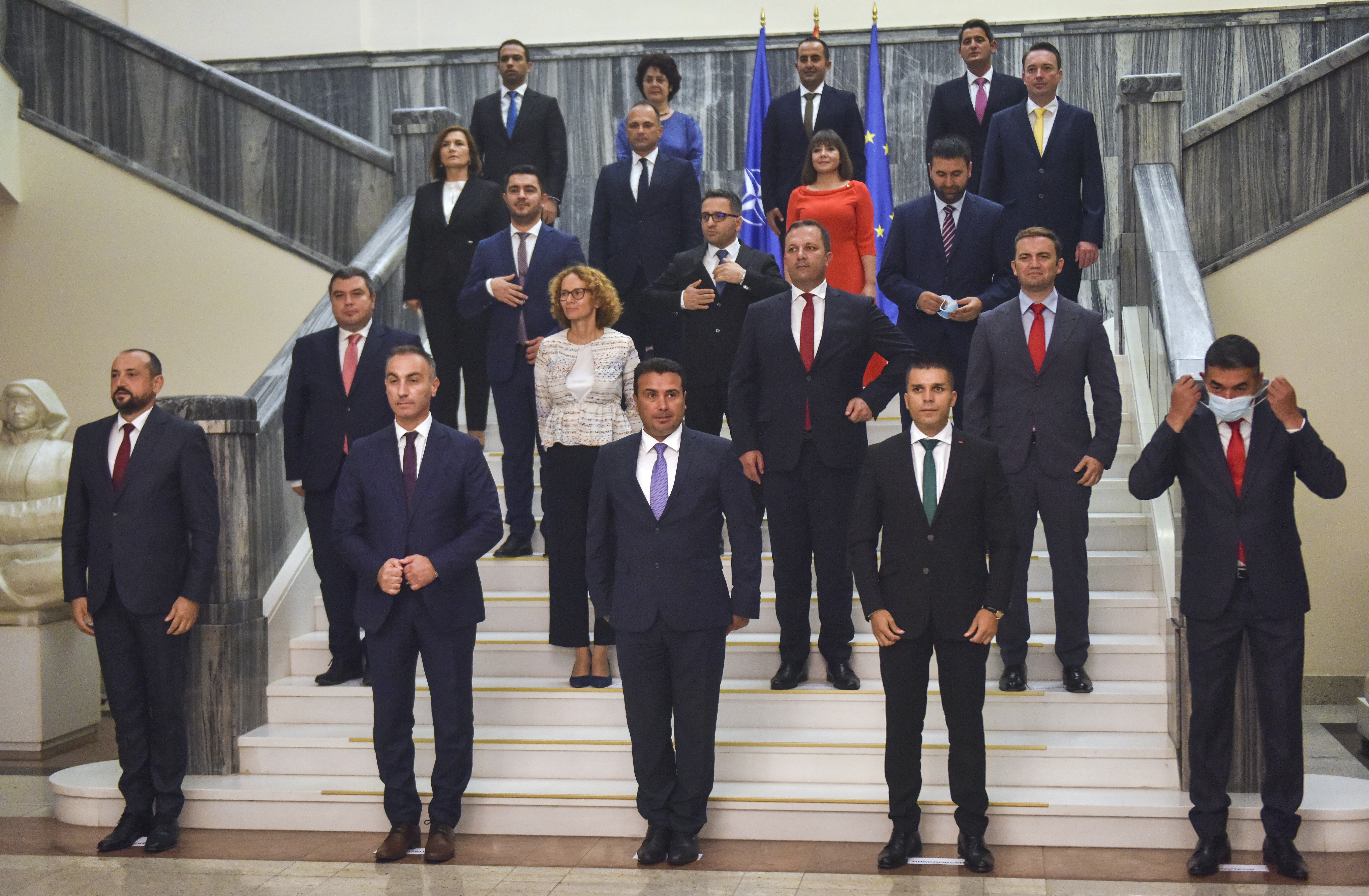 epa08636616 New Macedonian Prime Minister Zoran Zaev (first row, C) poses for photographers with members of his government after he was elected in the Macedonian parliament in Skopje,  Republic of North Macedonia, 30 August 2020.  EPA-EFE/GEORGI LICOVSKI