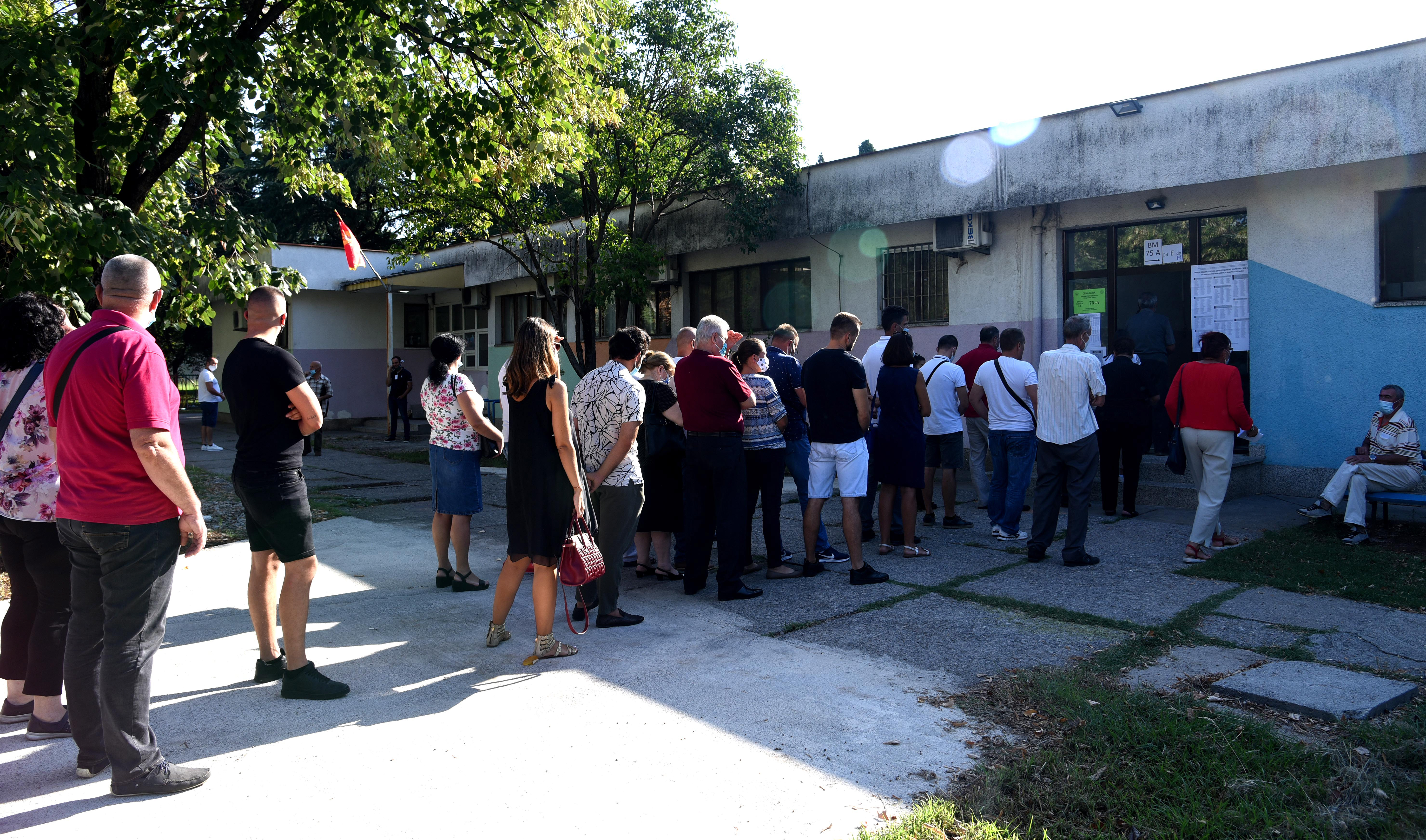 epa08635371 People wait in line to cast their votes at Montenegro's parliamentary elections in Podgorica, Montenegro, 30 August 2020. Montenegrian voters are choosing their representatives in the 81-seat National Assembly.  EPA-EFE/BORIS PEJOVIC
