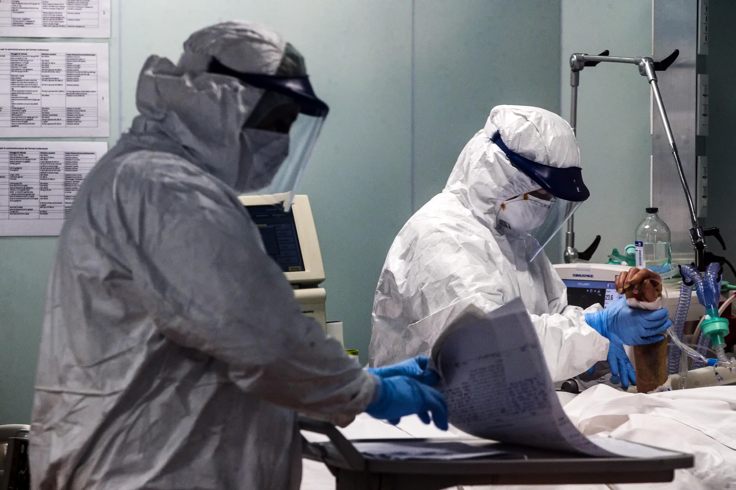 epa08377436 Doctors and nurses wearing protective equipment work in the COVID-3 level intensive care unit, treating COVID-19 patients, at the Casal Palocco hospital near Rome, Italy, 22 April 2020.  EPA-EFE/ANGELO CARCONI