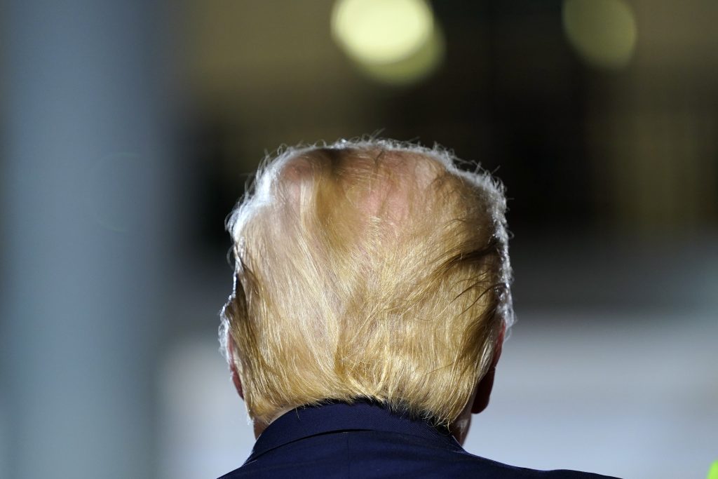 President Donald Trump listens to Christopher Macchio sing on South Lawn of the White House on the fourth day of the Republican National Convention, Thursday, Aug. 27, 2020, in Washington. (AP Photo/Evan Vucci)