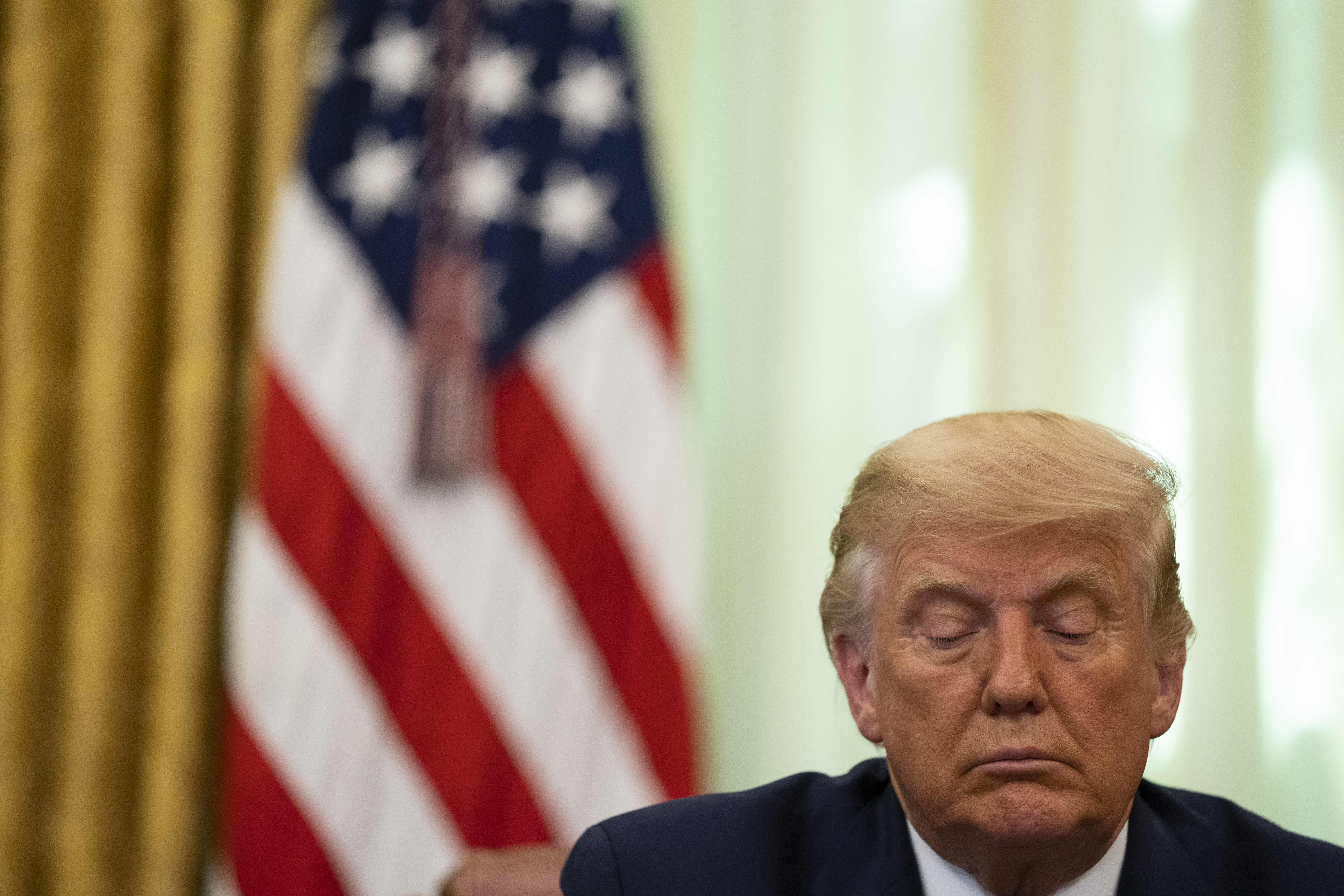 President Donald Trump listens during a signing ceremony with Serbian President Aleksandar Vucic and Kosovar Prime Minister Avdullah Hoti, in the Oval Office of the White House, Friday, Sept. 4, 2020, in Washington. (AP Photo/Evan Vucci)