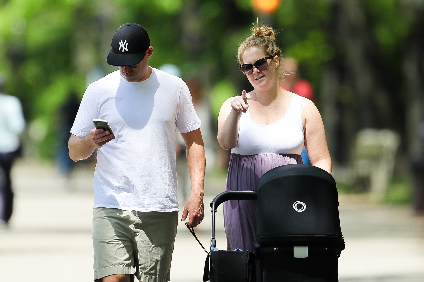 Amy Schumer and Chris Fischer take baby boy Gene to the park