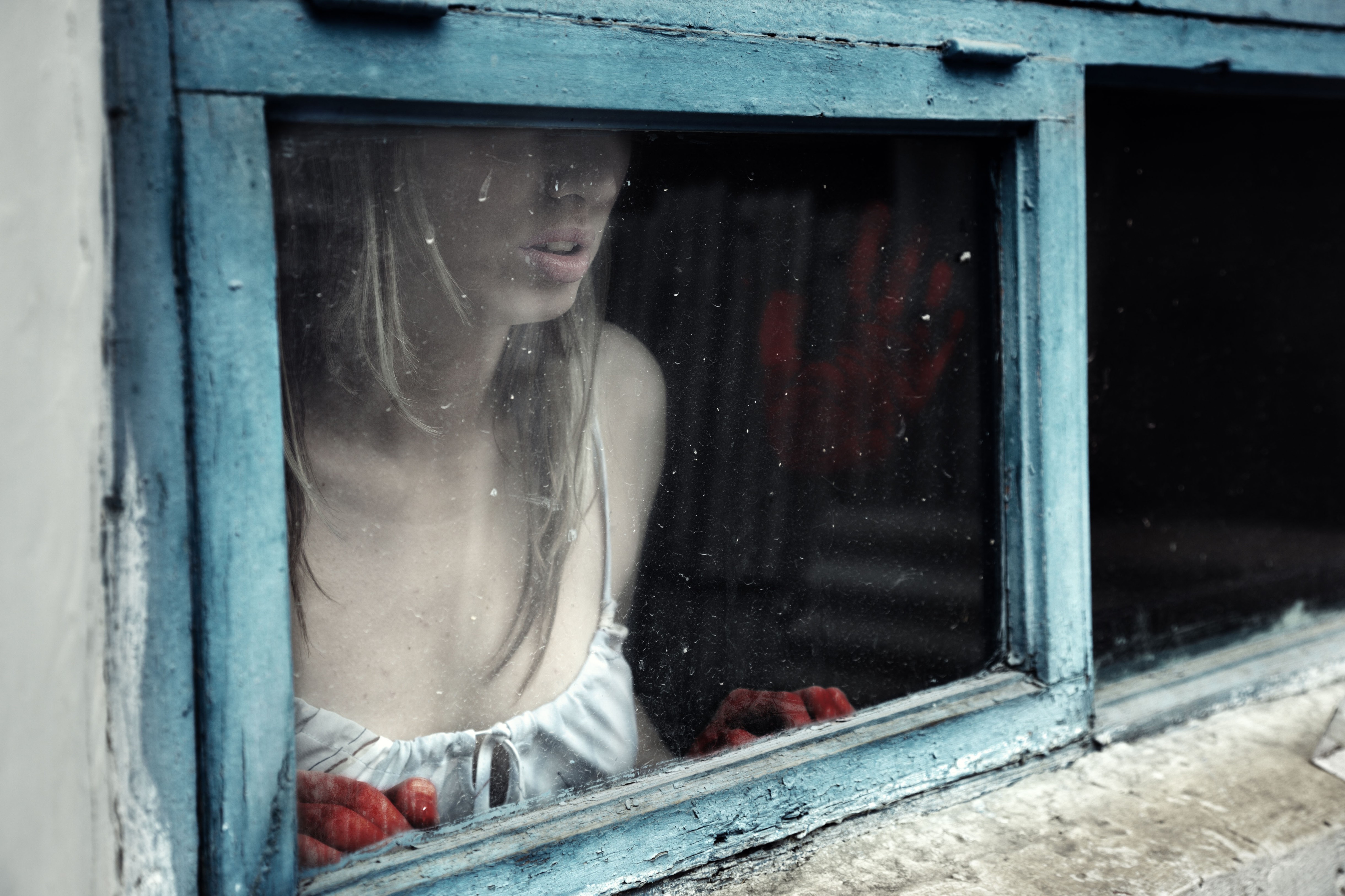 Woman with bloody hand behind the window, Image: 133966428, License: Royalty-free, Restrictions: , Model Release: yes, Credit line: Arman Zhenikeyev / Alamy / Alamy / Profimedia