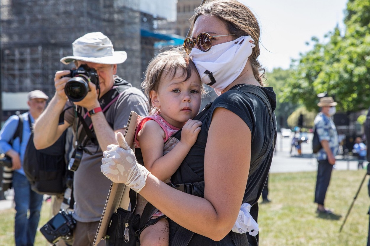 Parliament Square, London, UK. 30 May 2020. A few hundred environmental campaigners from Extinction Rebellion demonstrate peacefully in Parliament Square. Protesters hold placards, demand decisive action from the UK Government on the global environmental