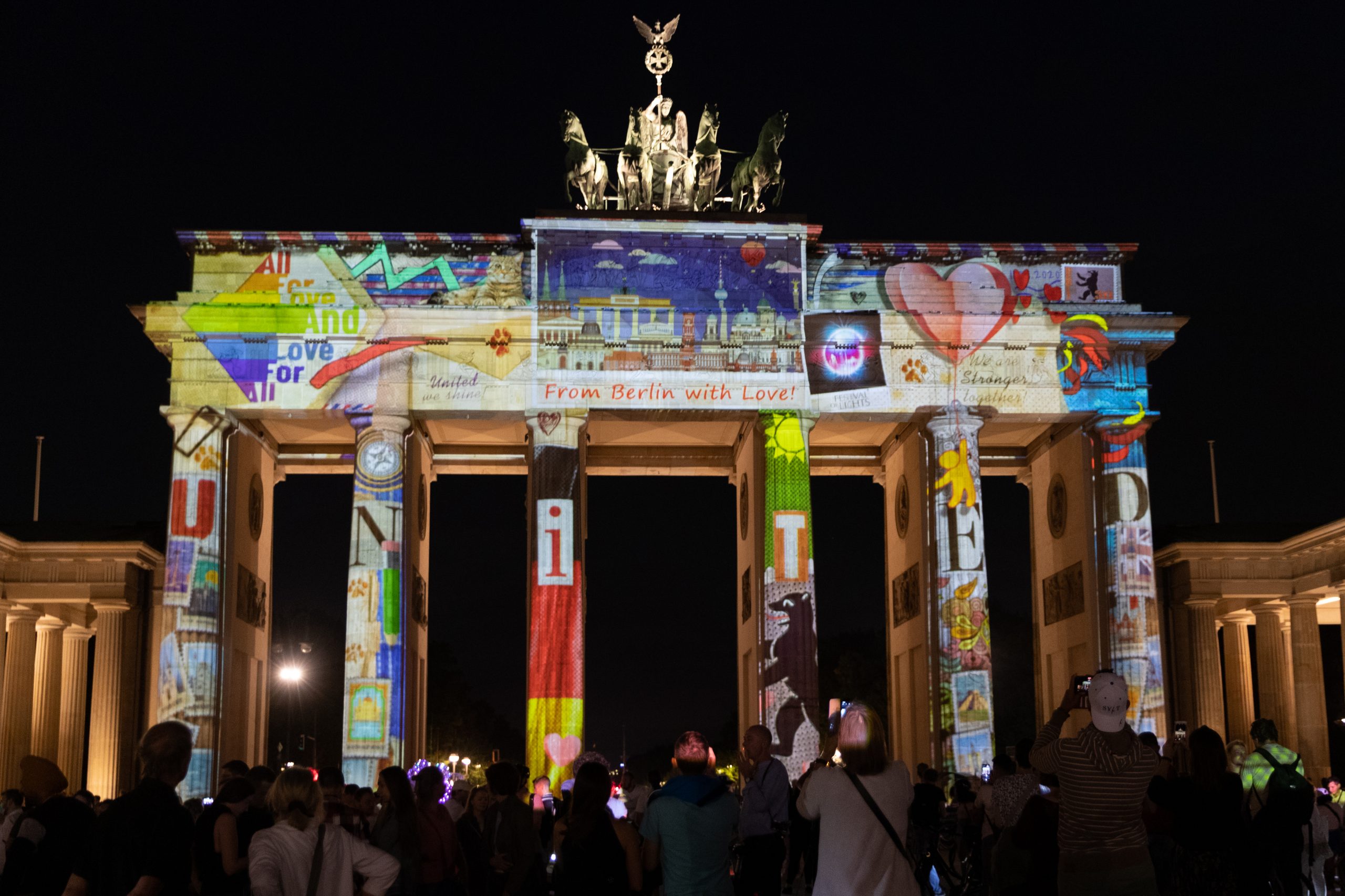 epa08674531 The Brandenburg Gate is illuminated by colourful images during the 'Festival of Lights' in Berlin, Germany, 16 September 2020. Berlin's famous landmarks will be projected with artworks of lights from 11 to 20 September.  EPA-EFE/HAYOUNG JEON