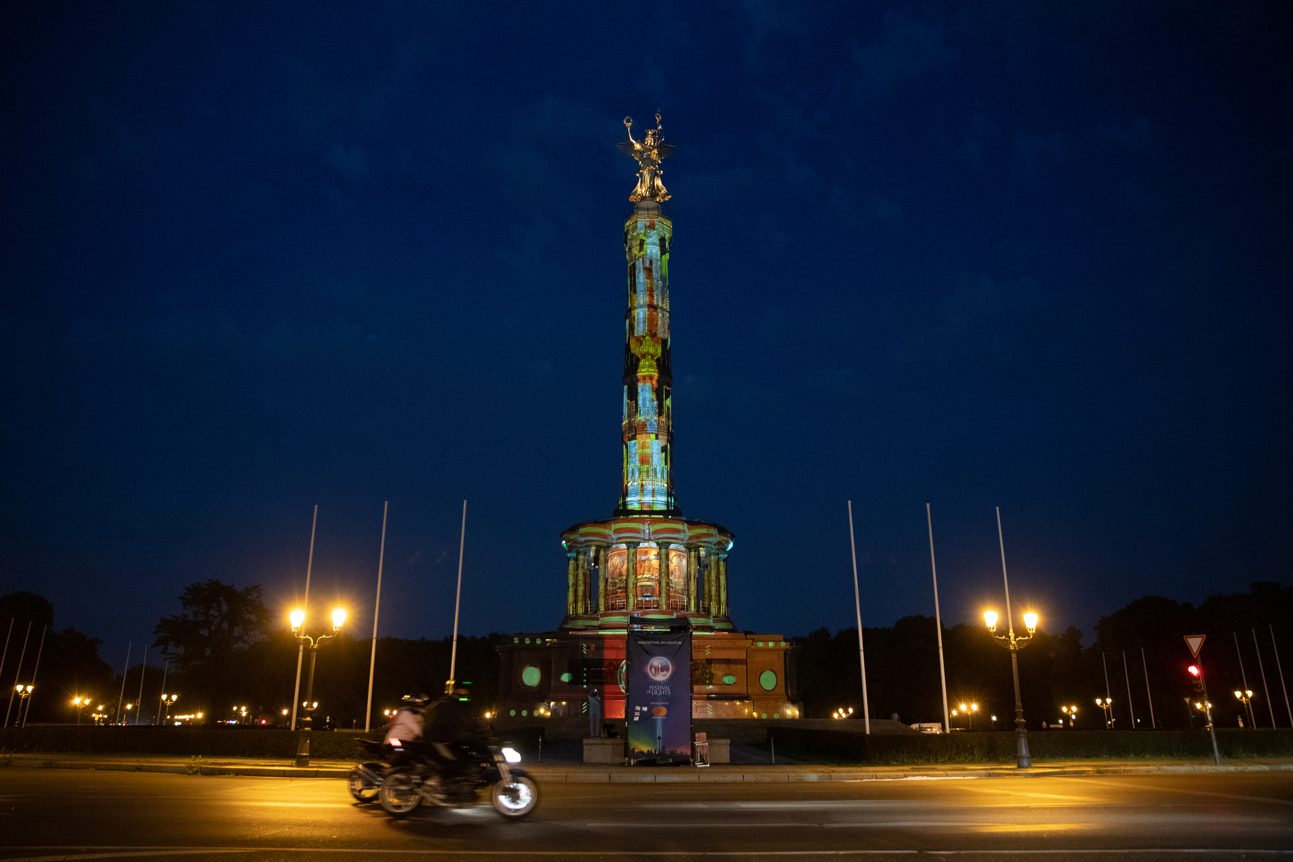 epa08674541 The Victory Column is illuminated by colourful images during the 'Festival of Lights' in Berlin, Germany, 16 September 2020. Berlin's famous landmarks will be projected with artworks of lights from 11 to 20 September.  EPA-EFE/HAYOUNG JEON