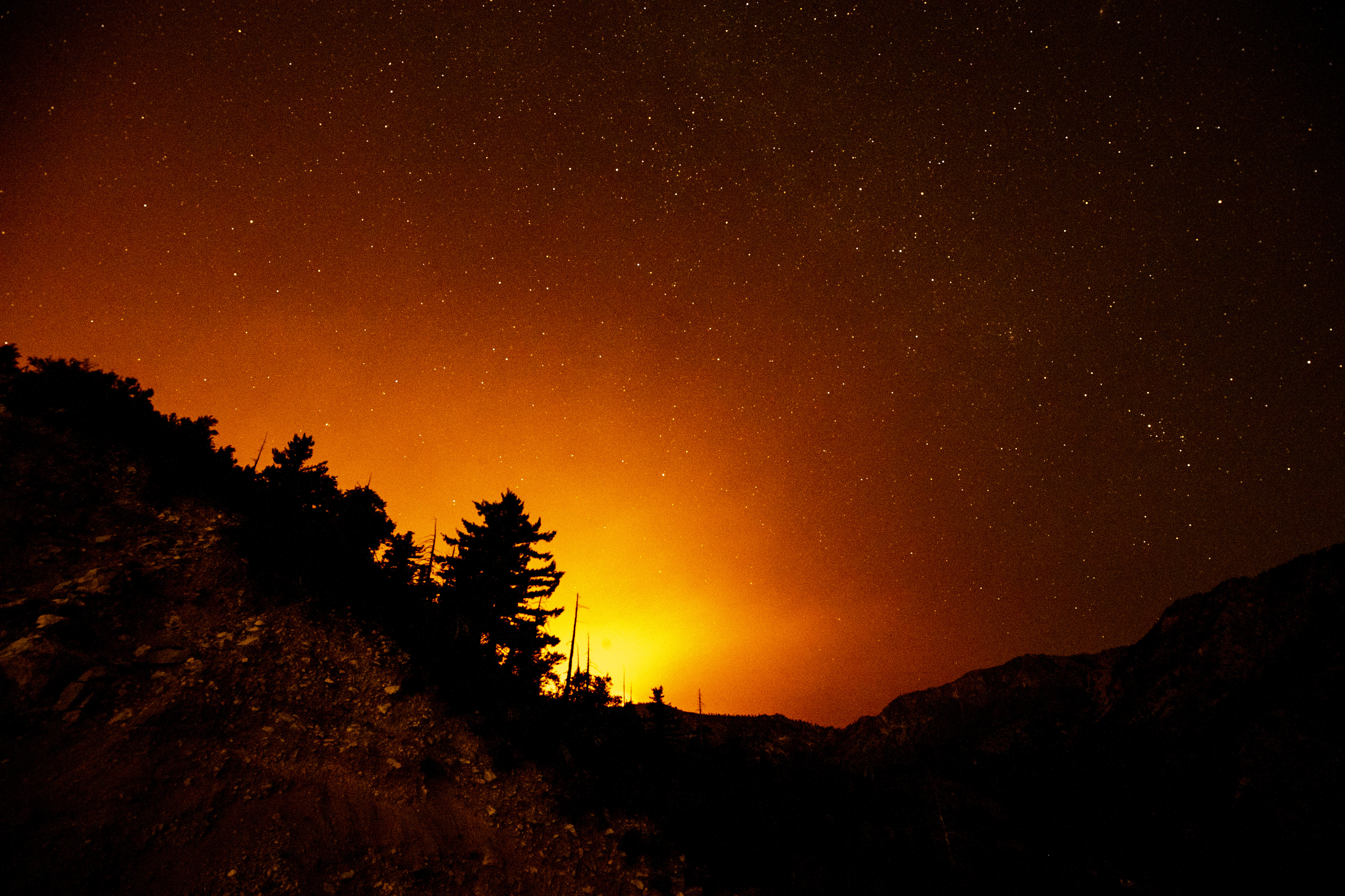 epaselect epa08675079 The Bobcat fire lights the night sky as it continues to burn in the Angeles National Forest, California, USA, 16 September 2020. According to reports, the Bobcat fire has burnt over 46,000 acres of forest.  EPA-EFE/ETIENNE LAURENT
