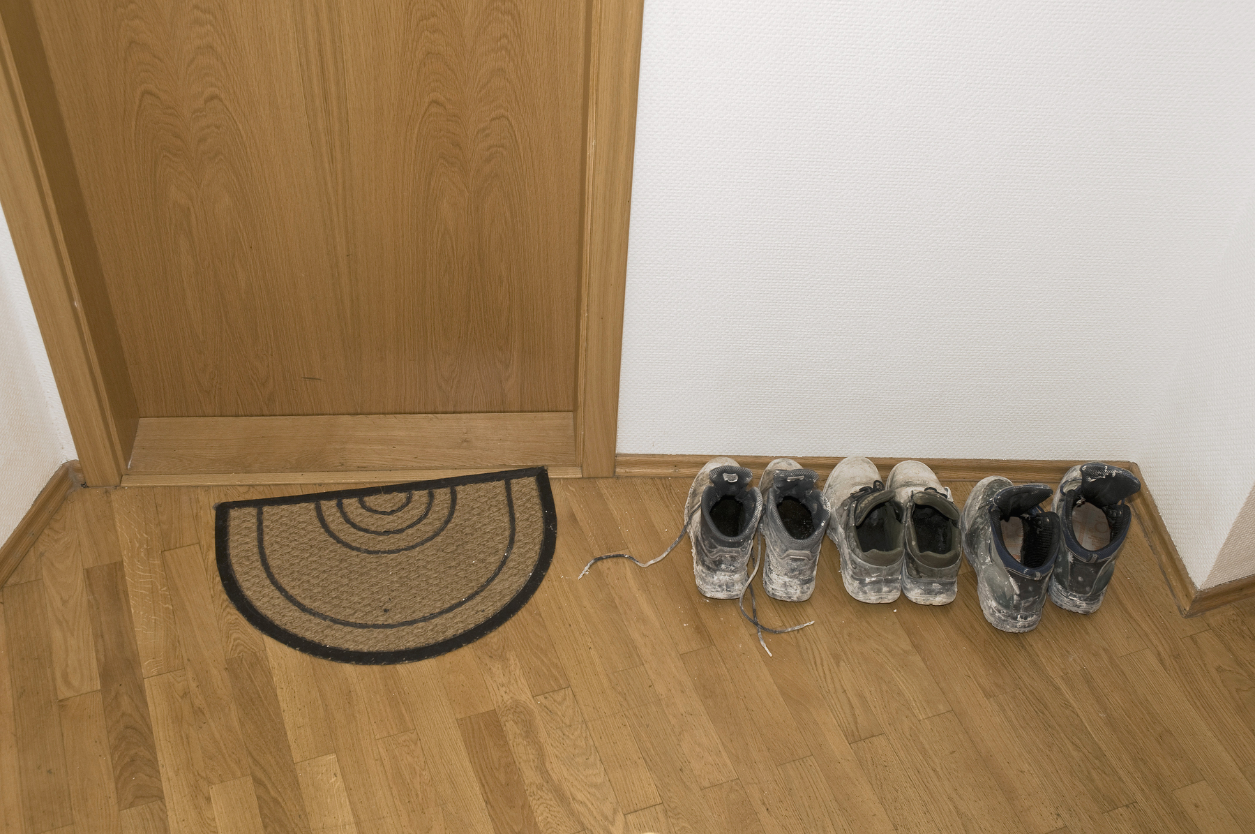 Dirty shoes in the hallway next to the entrance door in an apartment building,Image: 88235298, License: Rights-managed, Restrictions: , Model Release: no, Credit line: Hartmut Schmidt / imageBROKER / Profimedia
