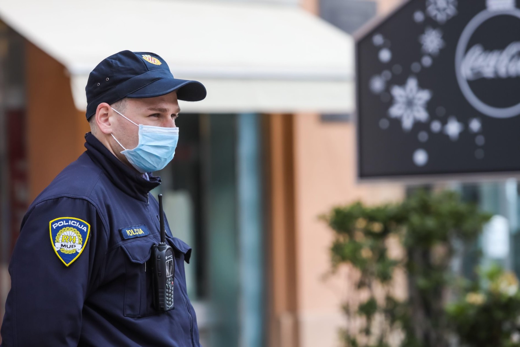 Zagreb, Croatia - 01 May, 2020 : Policeman wears a protective medicine mask because of coronavirus on the streets of Zagreb, Croatia.