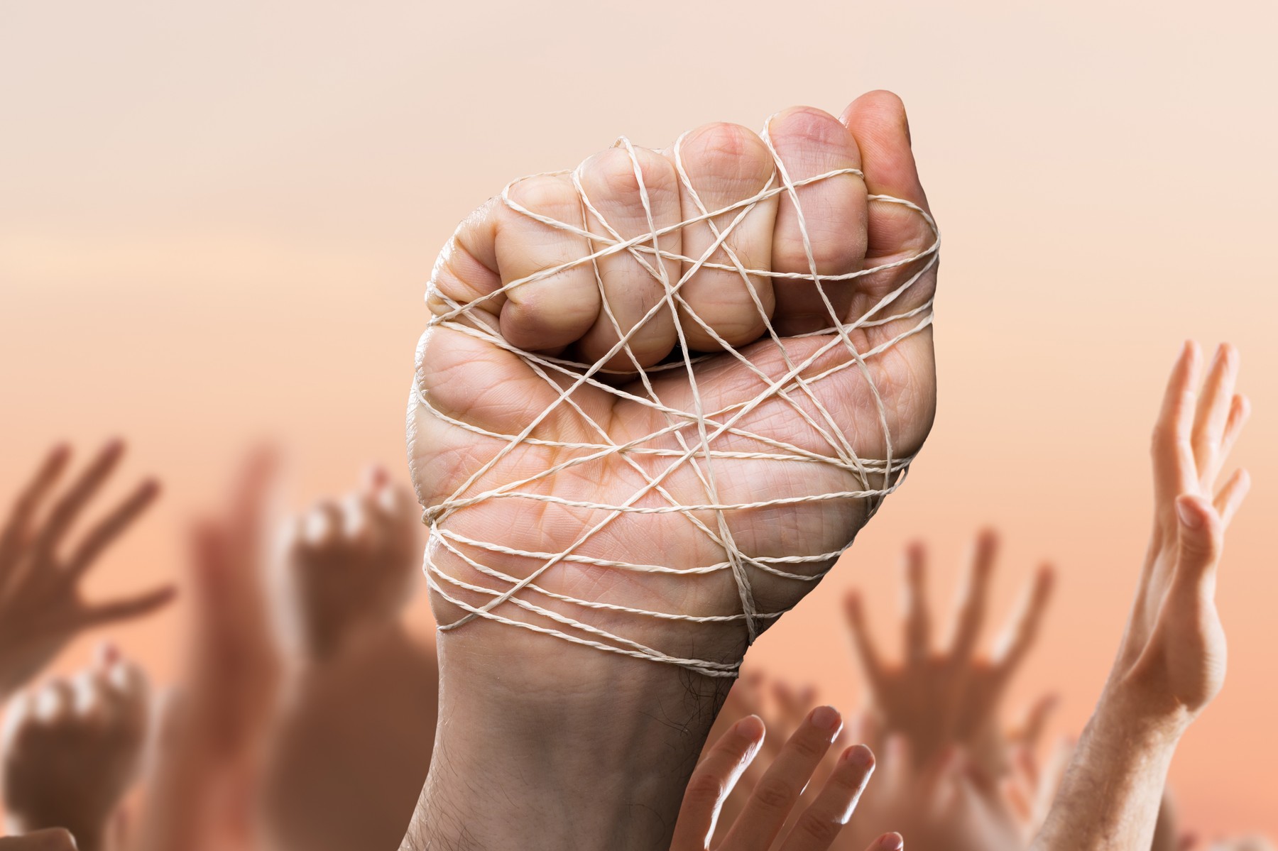 Man Hand Tied With Wire In Crowd, Image: 494073919, License: Royalty-free, Restrictions: , Model Release: no, Credit line: Andriy Popov / Panthermedia / Profimedia