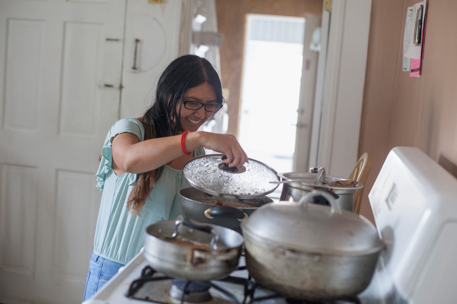 Woman with Visual Impairment cooking food in the kitchen,Image: 466335979, License: Royalty-free, Restrictions: , Model Release: no, Credit line: Mark Hunt / DesignPics / Profimedia