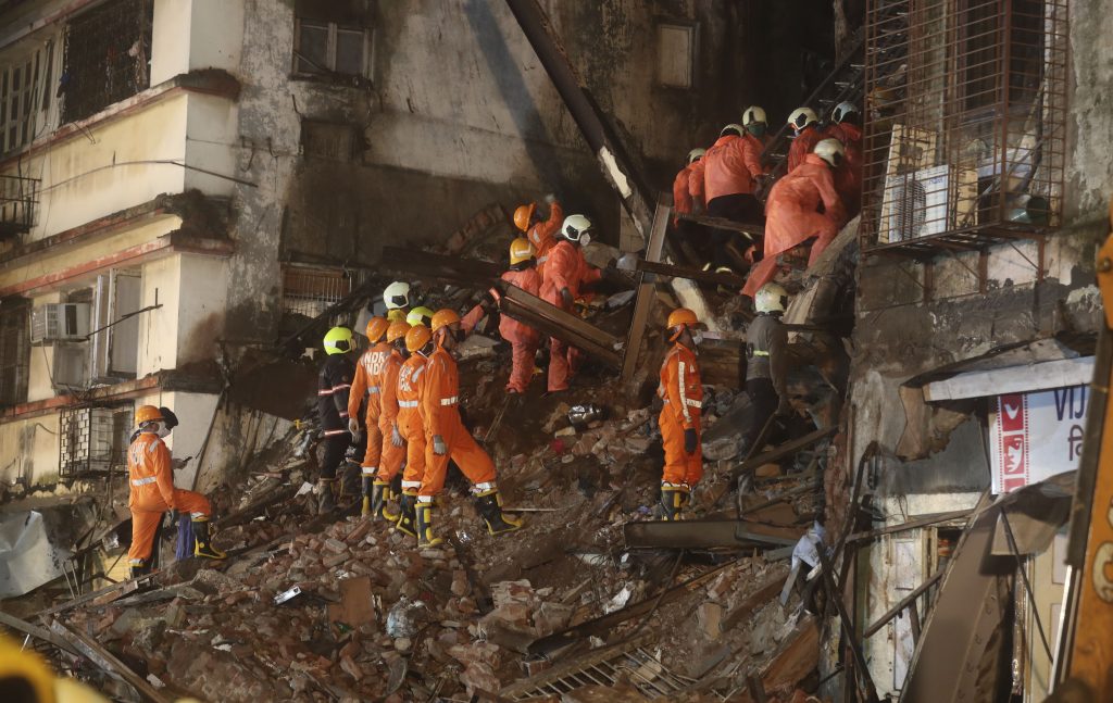 Rescuers work at the site after a six-storey residential building collapsed in Mumbai, India, Thursday, July 16, 2020. (AP Photo/Rafiq Maqbool)