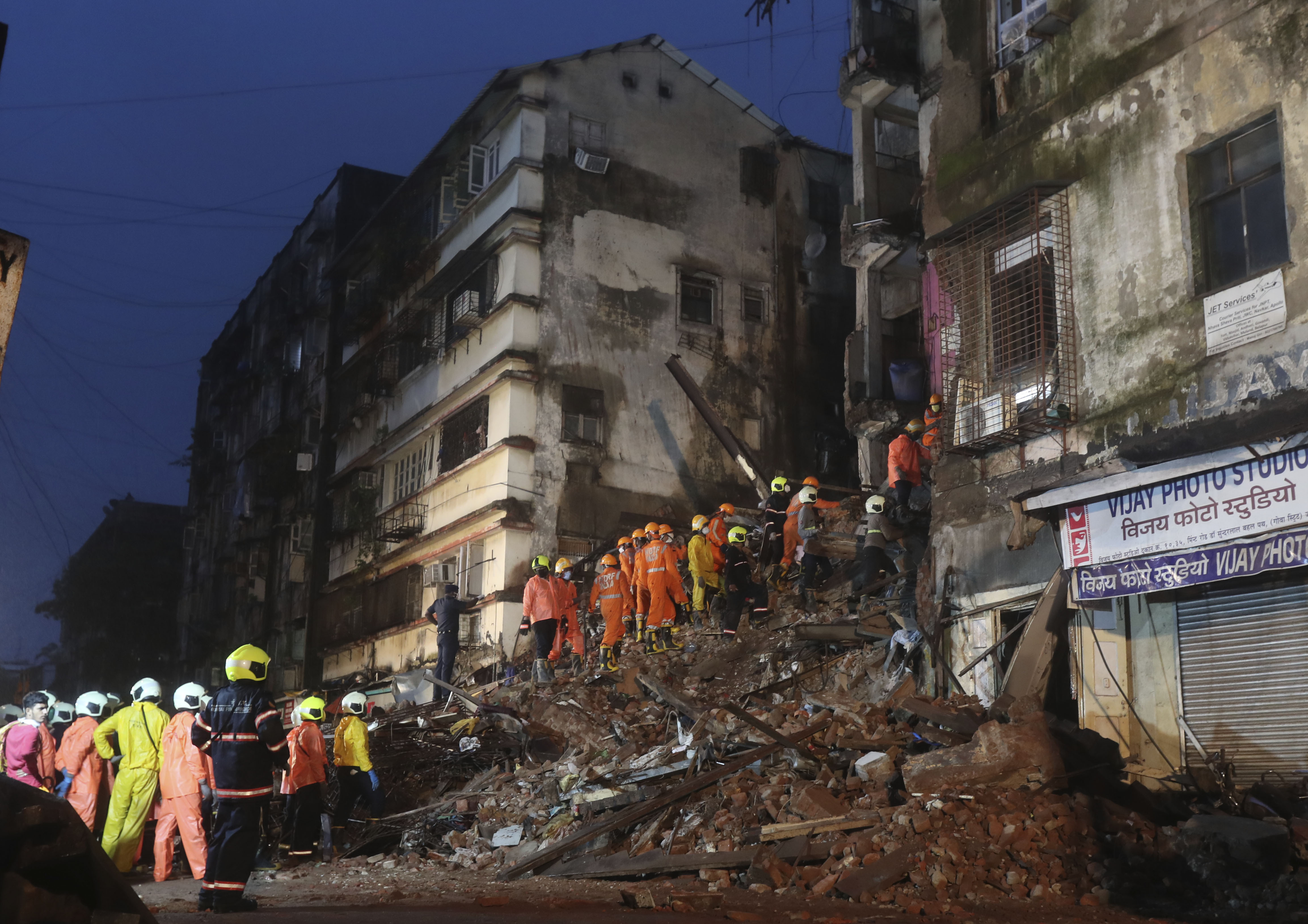 Rescuers work at the site after a six-storey residential building collapsed in Mumbai, India, Thursday, July 16, 2020. (AP Photo/Rafiq Maqbool)