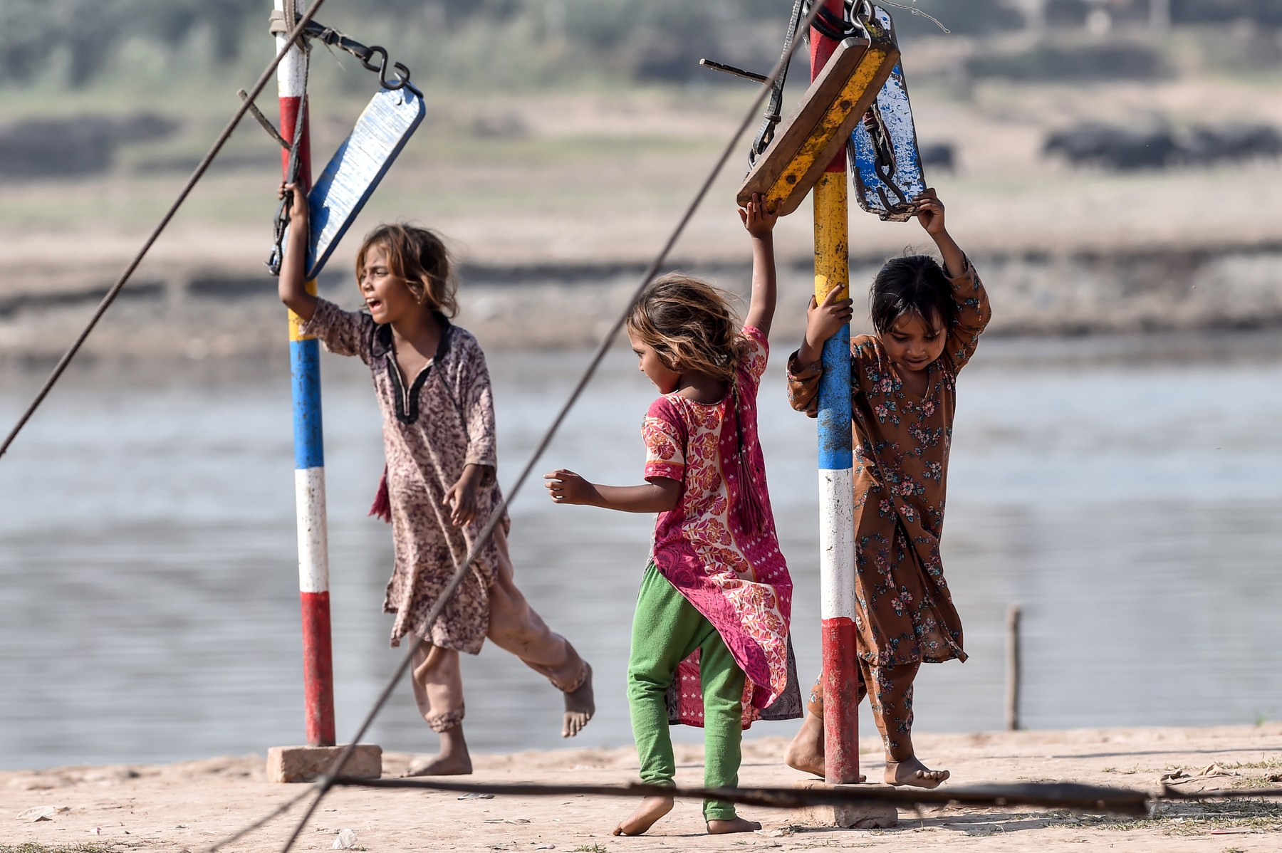 Young girls gather around swings in Lahore on October 11, 2020, on the International Day of the Girl Child.,Image: 562461496, License: Rights-managed, Restrictions: , Model Release: no, Credit line: Arif ALI / AFP / Profimedia