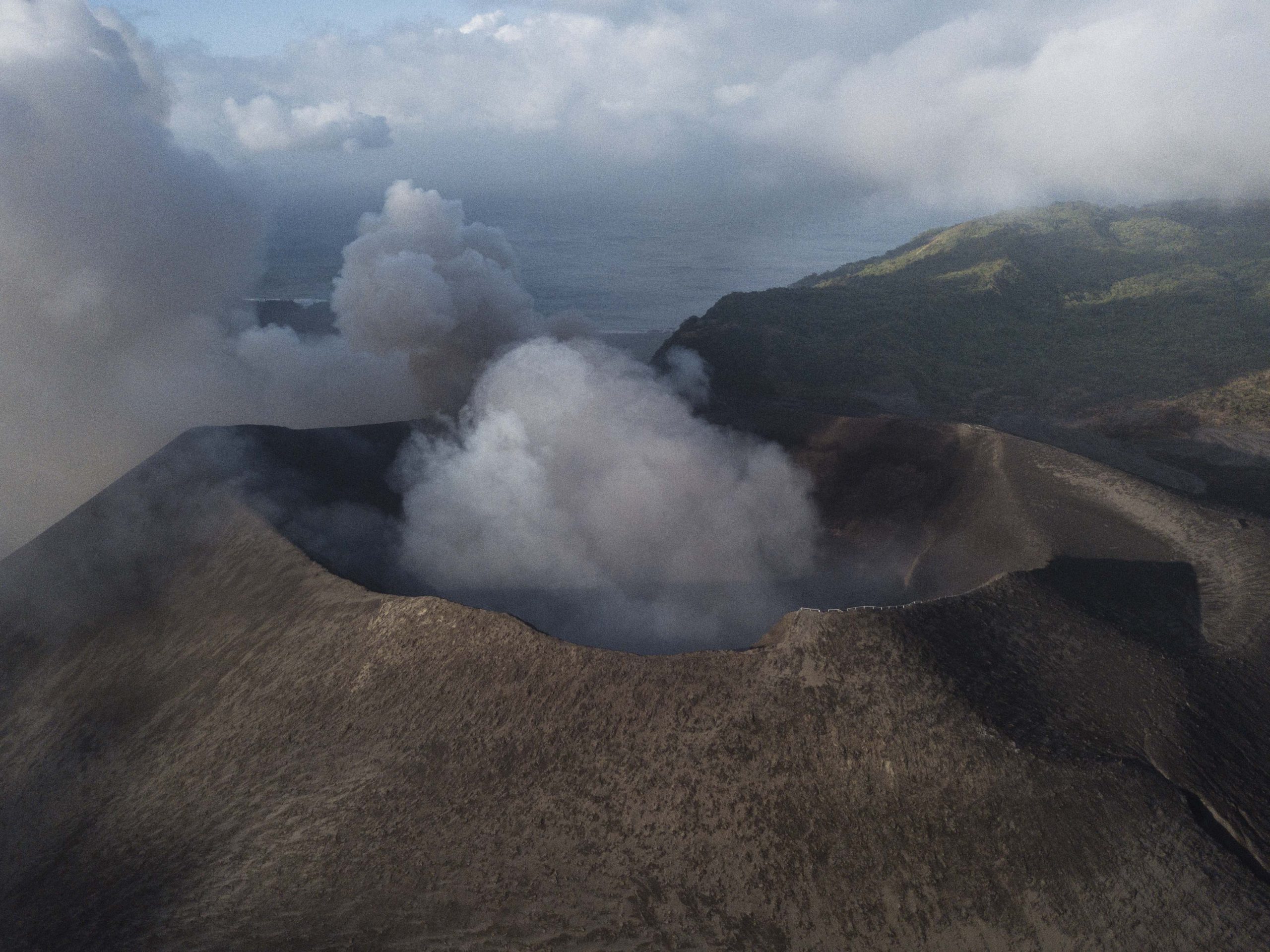 Alexander Schulz, 28, from Germany, and Rafael Bridi, 33, from Brazil crossed the Yasur volcano crater on Tanna Island, Pacific Ocean