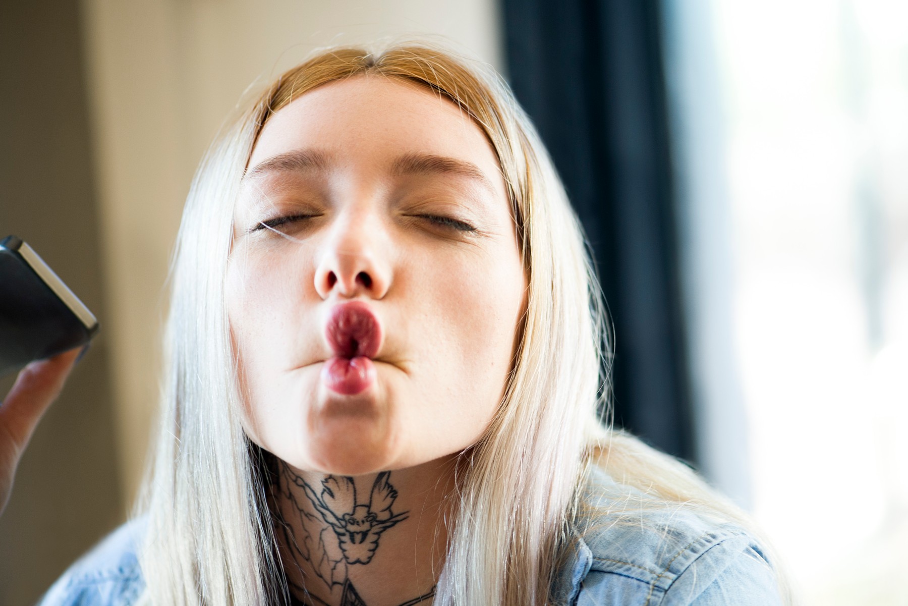 Young woman making funny face, portrait, Image: 355437697, License: Royalty-free, Restrictions: , Model Release: yes, Credit line: - / PhotoAlto / Profimedia