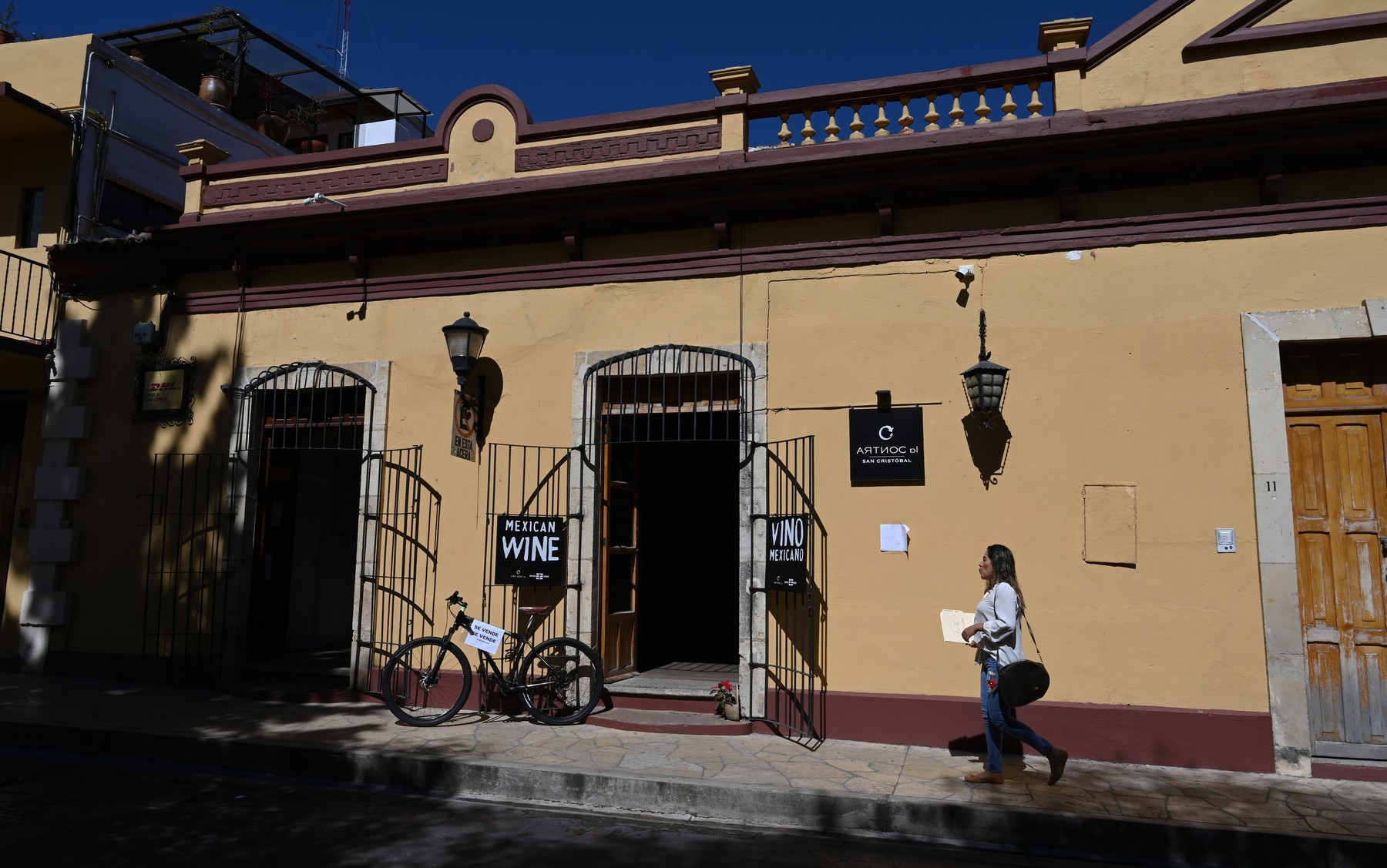 A women walk past in front of a store in San Cristobal de las Casas, Chiapas State, Mexico, on January 10, 2020.,Image: 492997077, License: Rights-managed, Restrictions: , Model Release: no, Credit line: RODRIGO ARANGUA / AFP / Profimedia