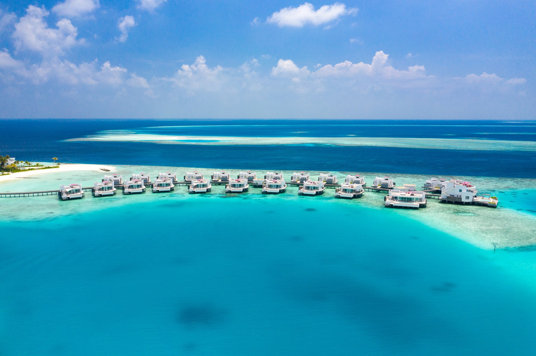 The stunning Maldives holiday resort that swaps beach huts for penthouse style swellings with rooftop decks
