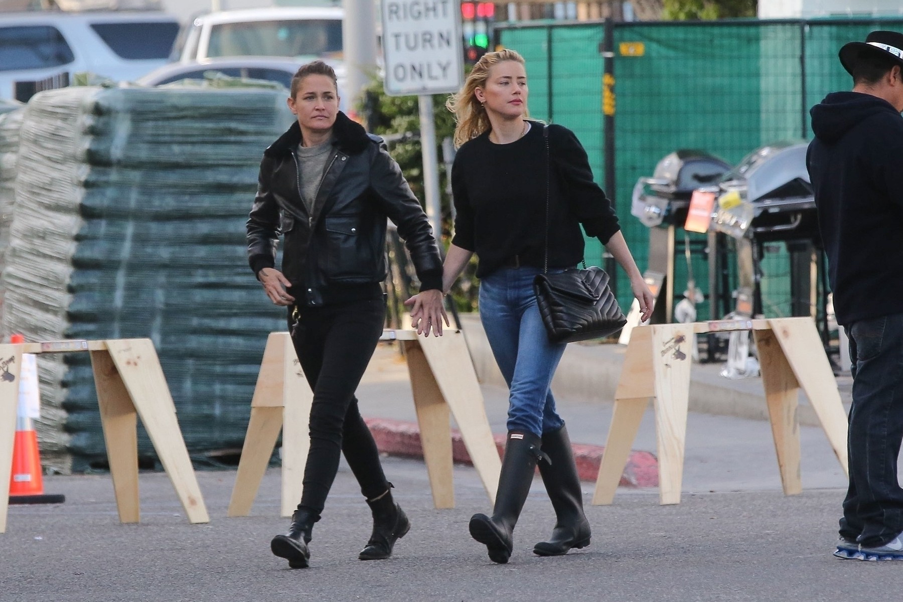 *EXCLUSIVE* Amber Heard and Bianca Butti hold hands shopping for plants and firewood at busy Home Depot