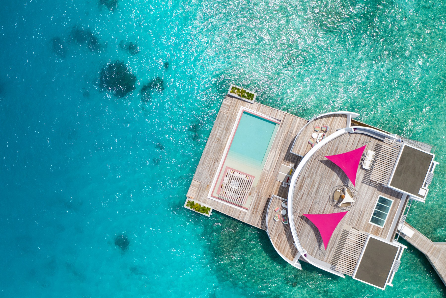 The stunning Maldives holiday resort that swaps beach huts for penthouse style swellings with rooftop decks