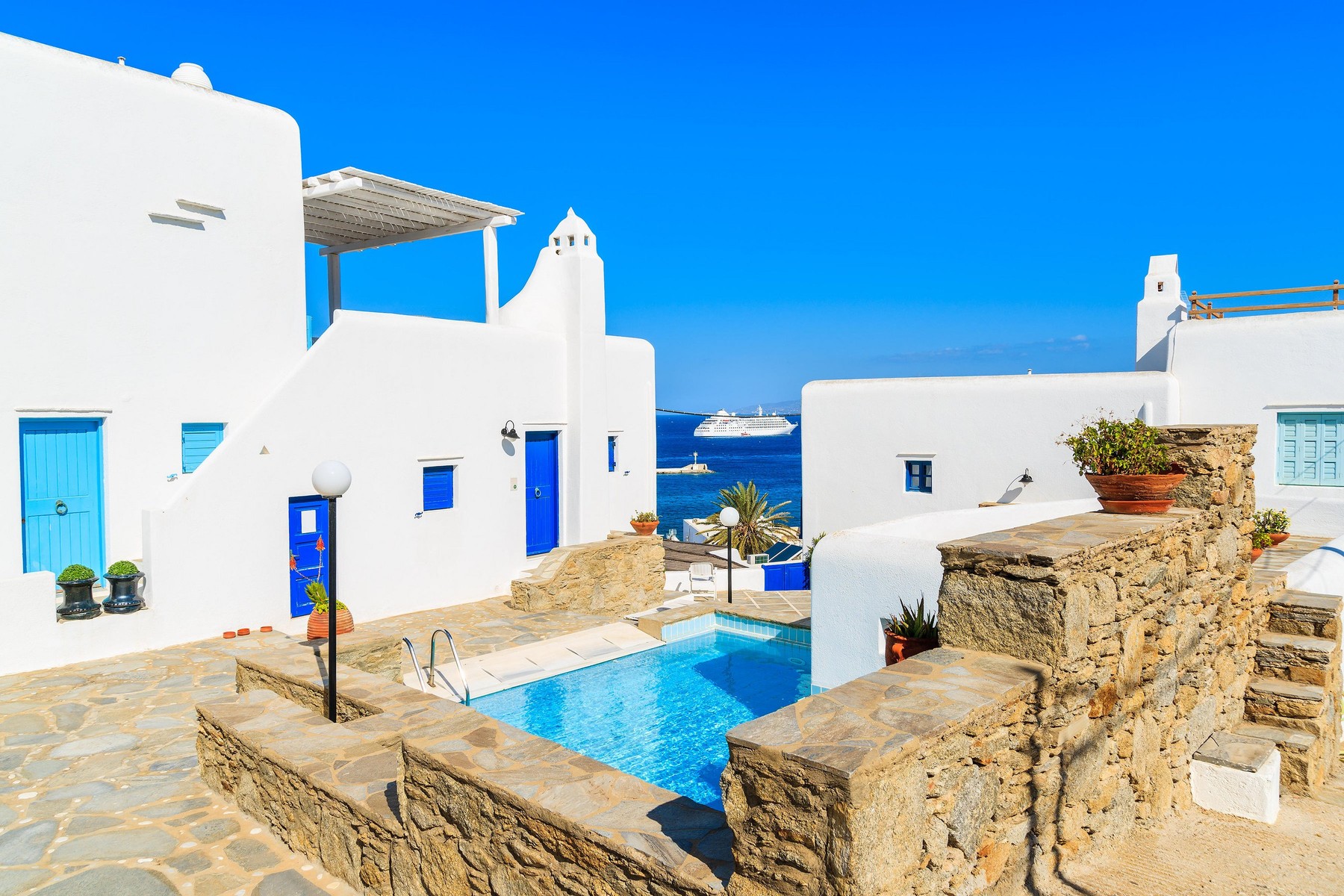MYKONOS ISLAND, GREECE - MAY 17, 2016: luxury holiday apartments with swimming pool in beautiful Mykonos town, Cyclades islands,